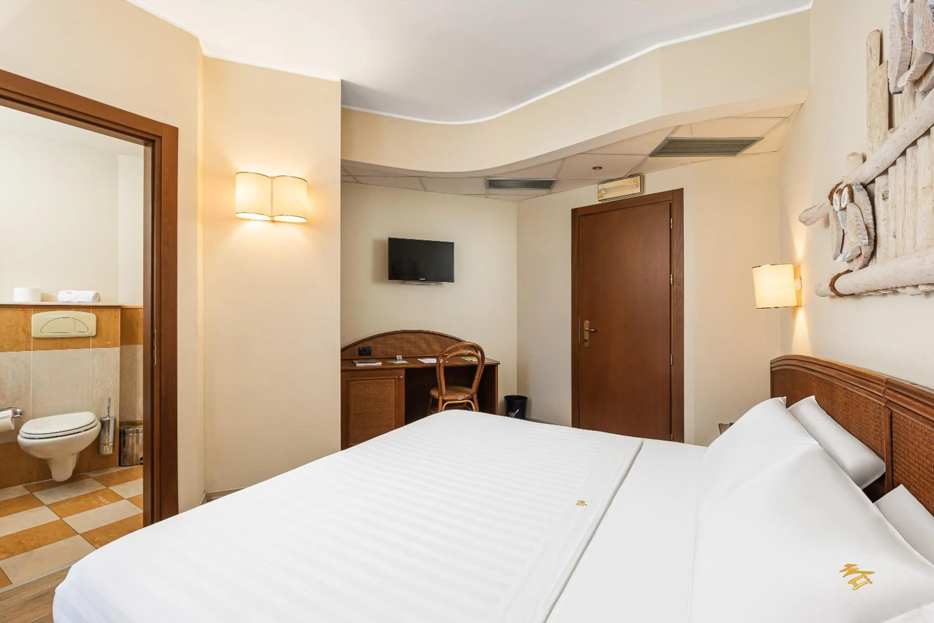 Bed in Welcome Hotel