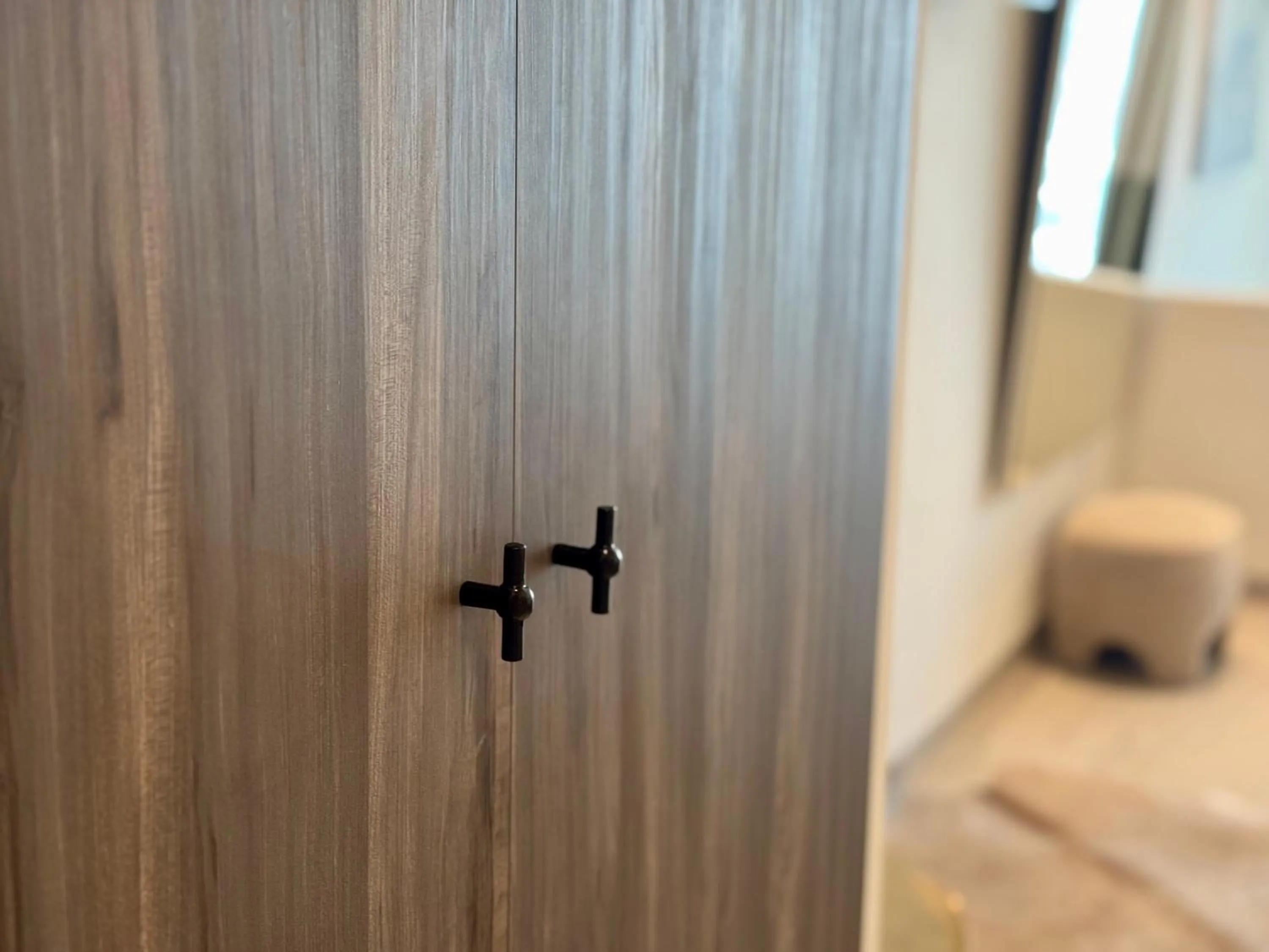 wardrobe, Bed in Comfy Studios Hotel