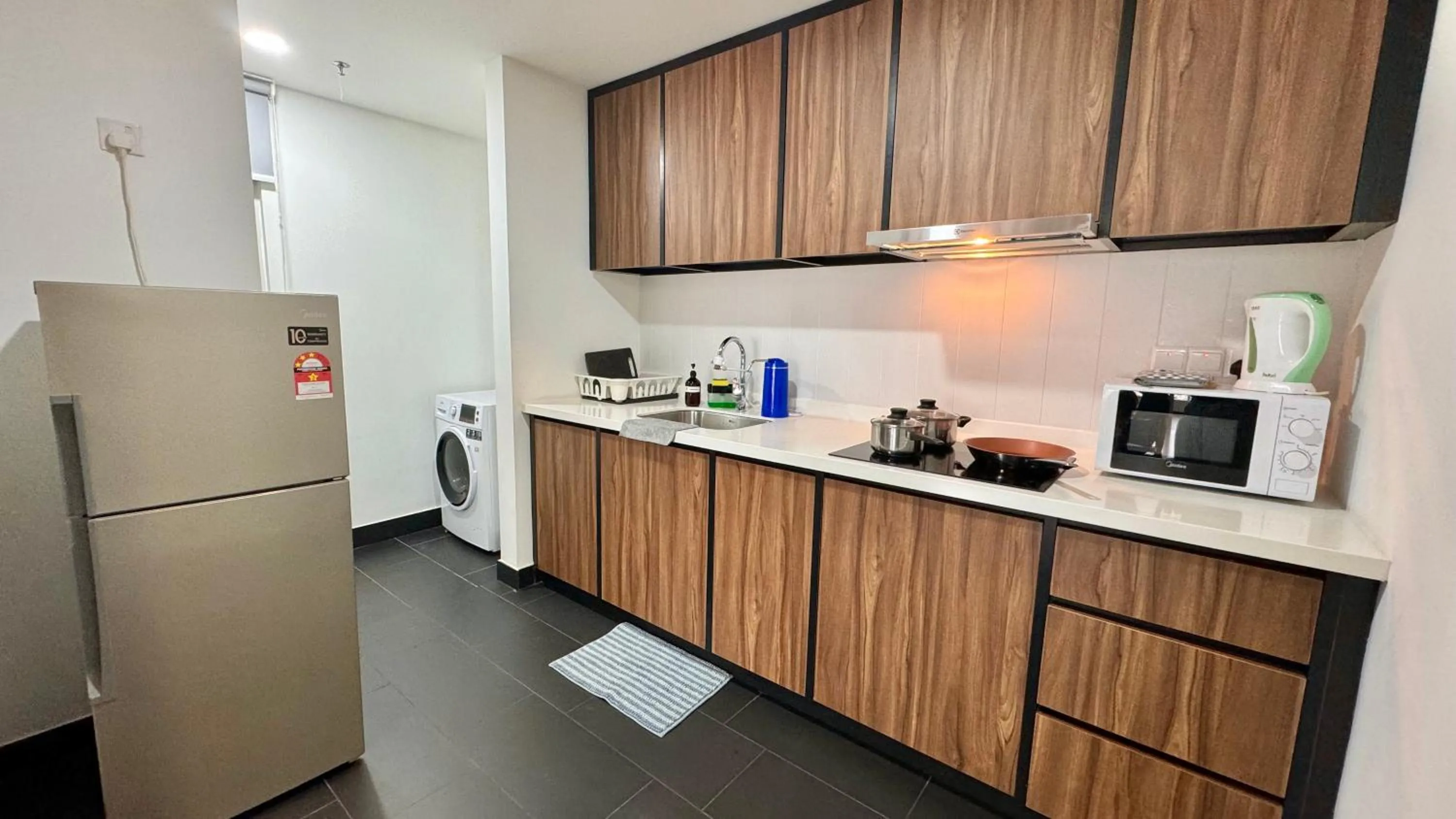 Kitchen or kitchenette in UNA Serviced Apartment by manatidur