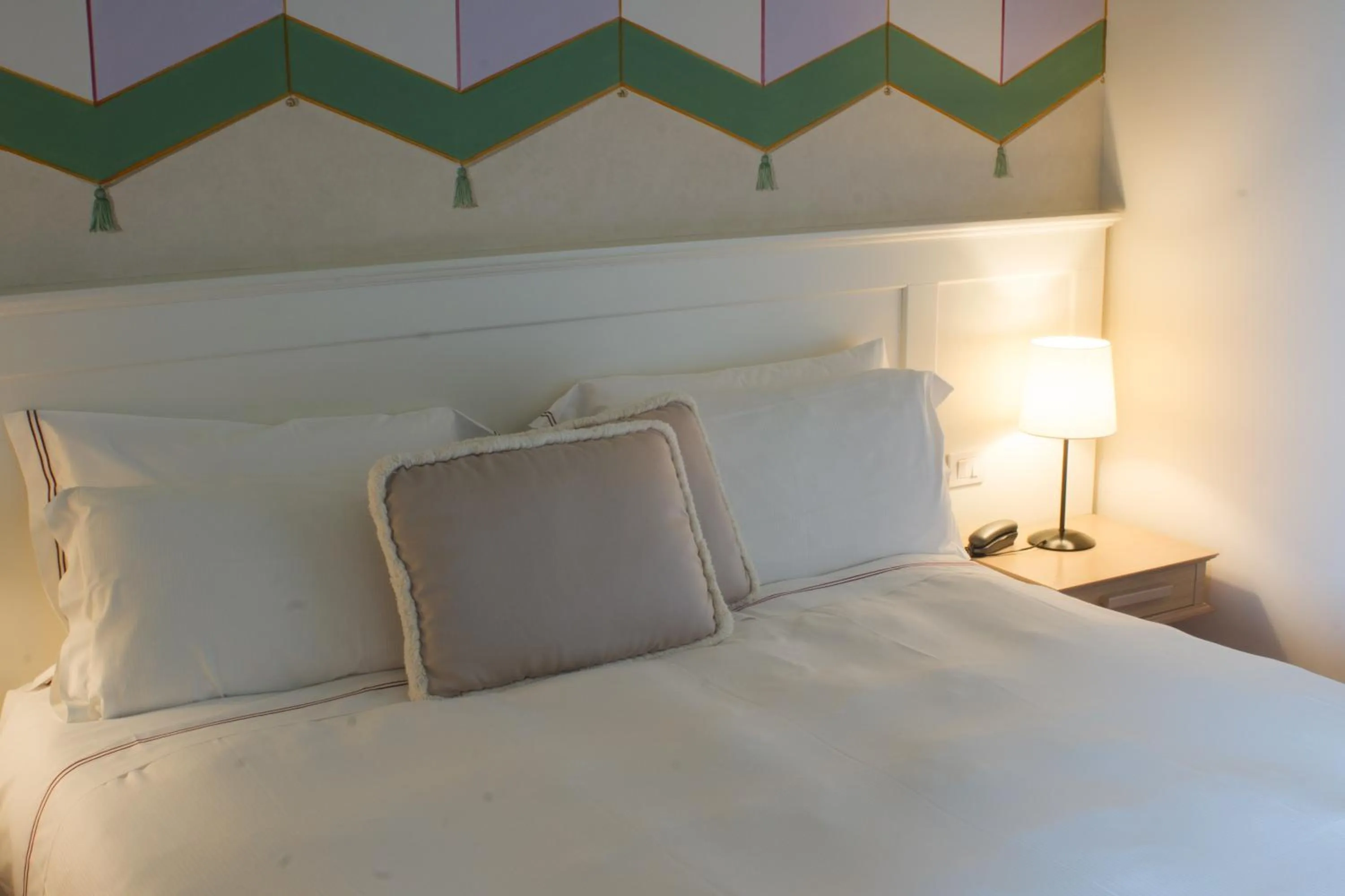 Bed in Saturnia Tuscany Hotel