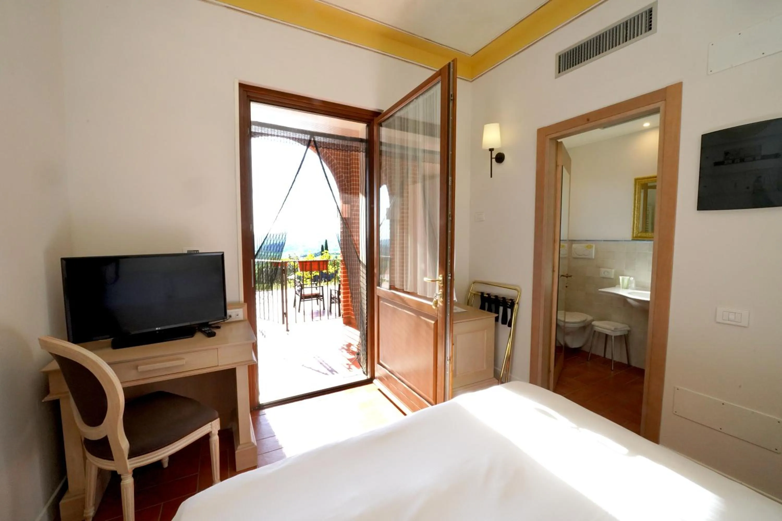 Bed in Saturnia Tuscany Hotel