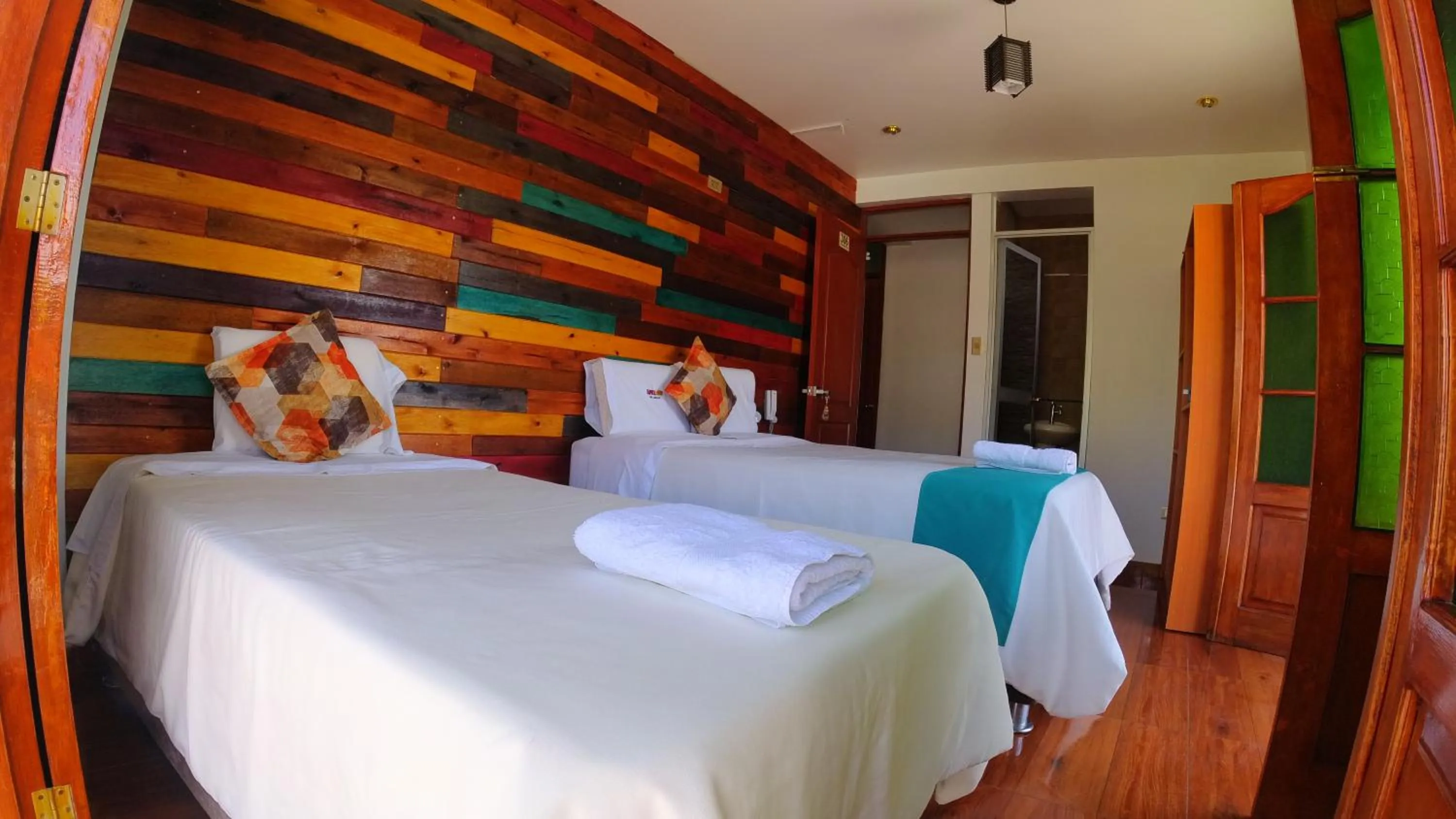 Bed in Sumaq Wari Hotel