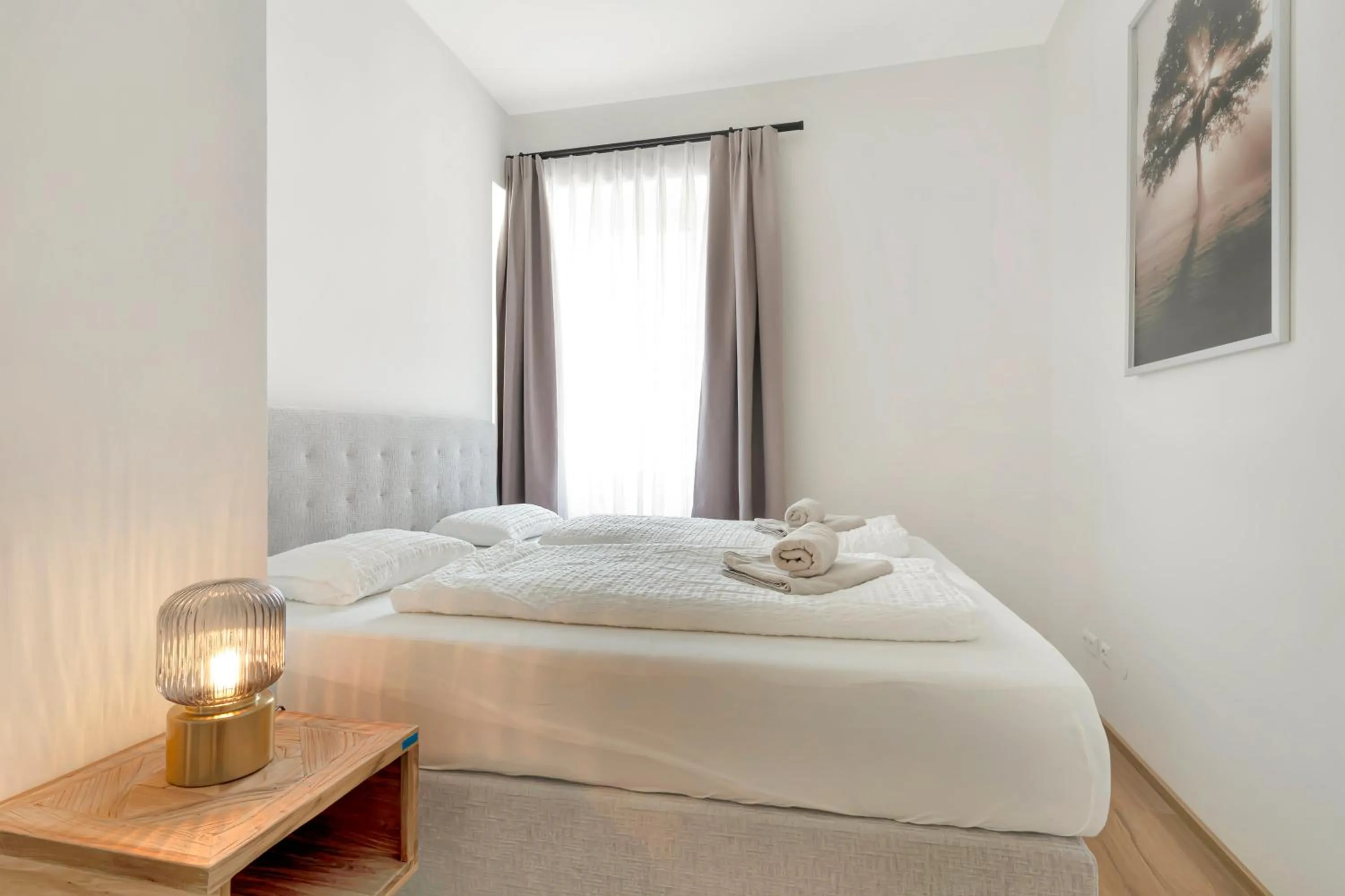Bed in easy-flat Hauptplatz - City Center Apartments with a Kitchen