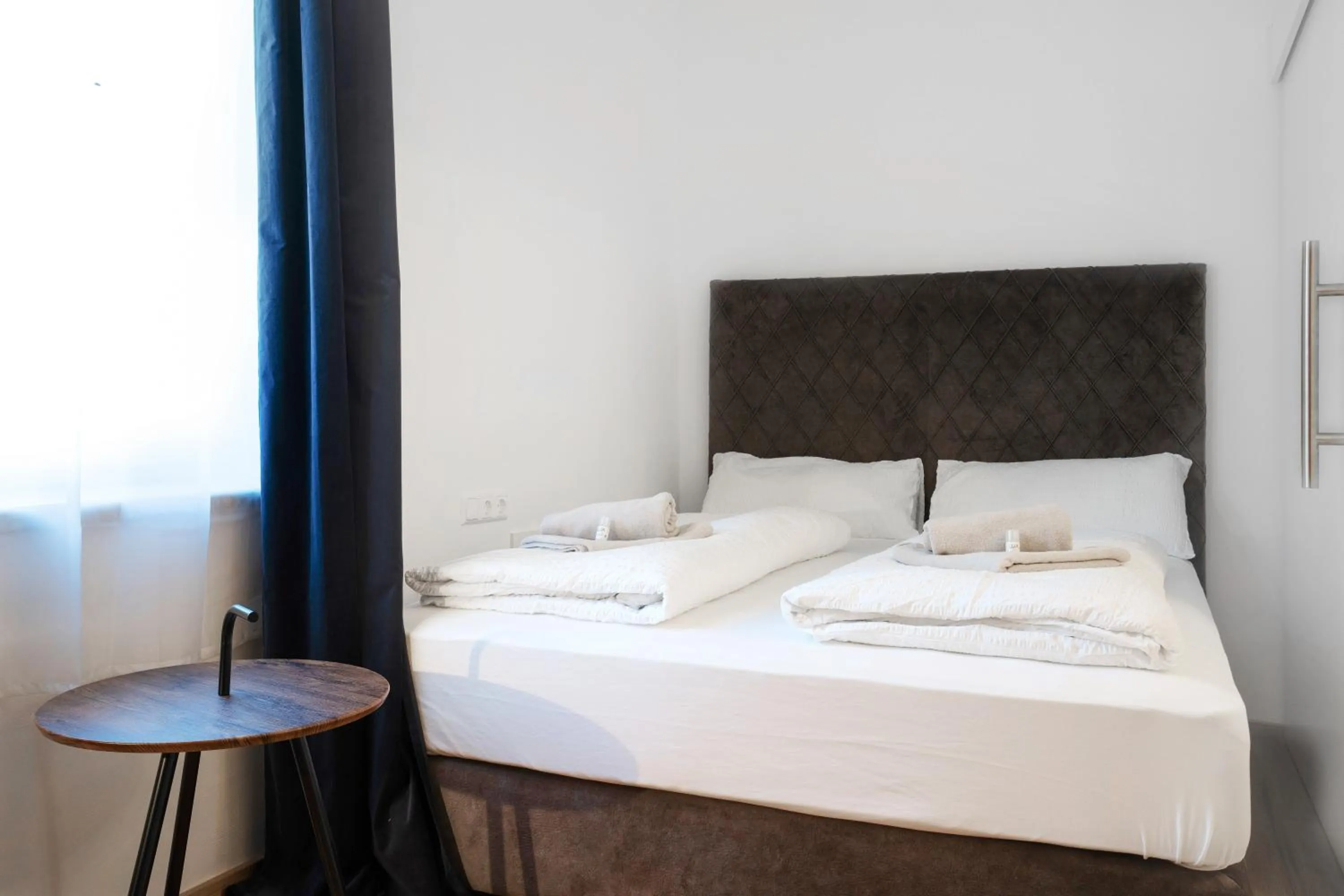 Bed in easy-flat Hauptplatz - City Center Apartments with a Kitchen