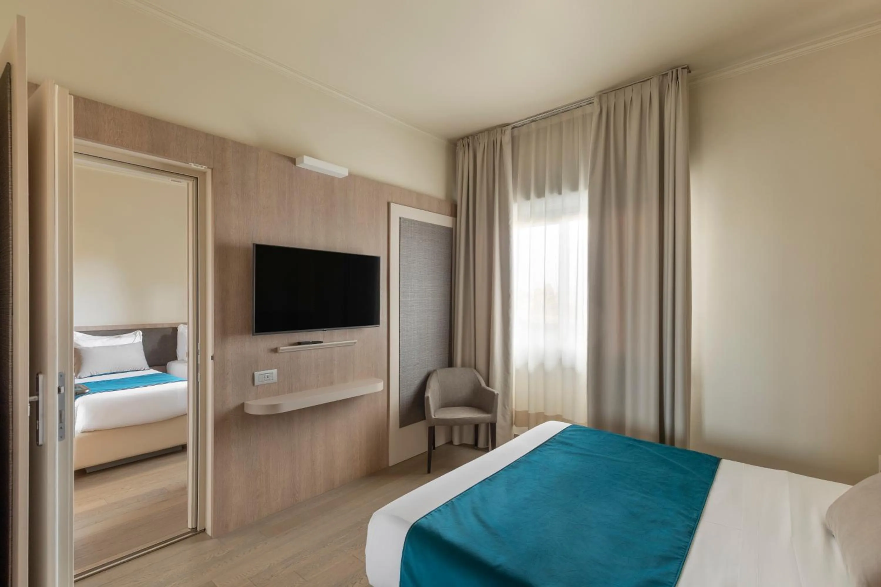 Bed in Living Hotel Milano