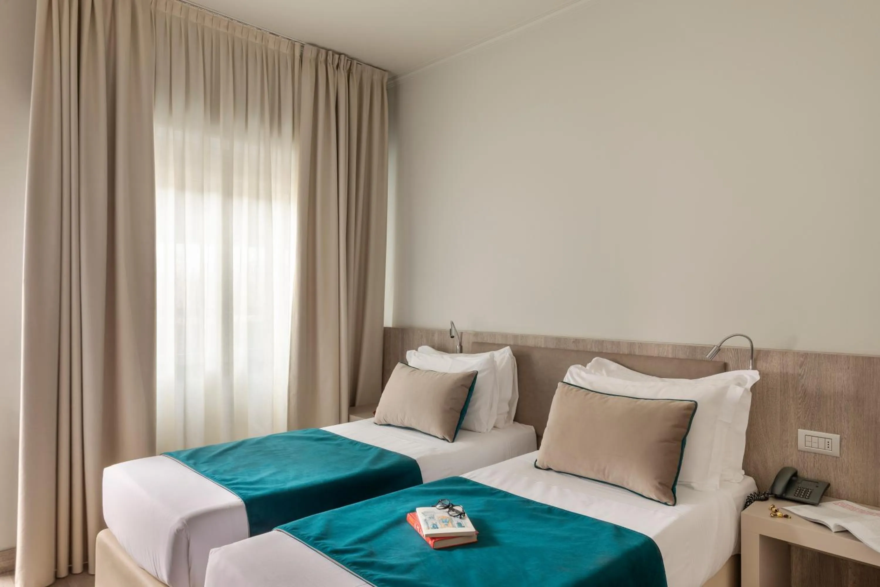 Bed in Living Hotel Milano