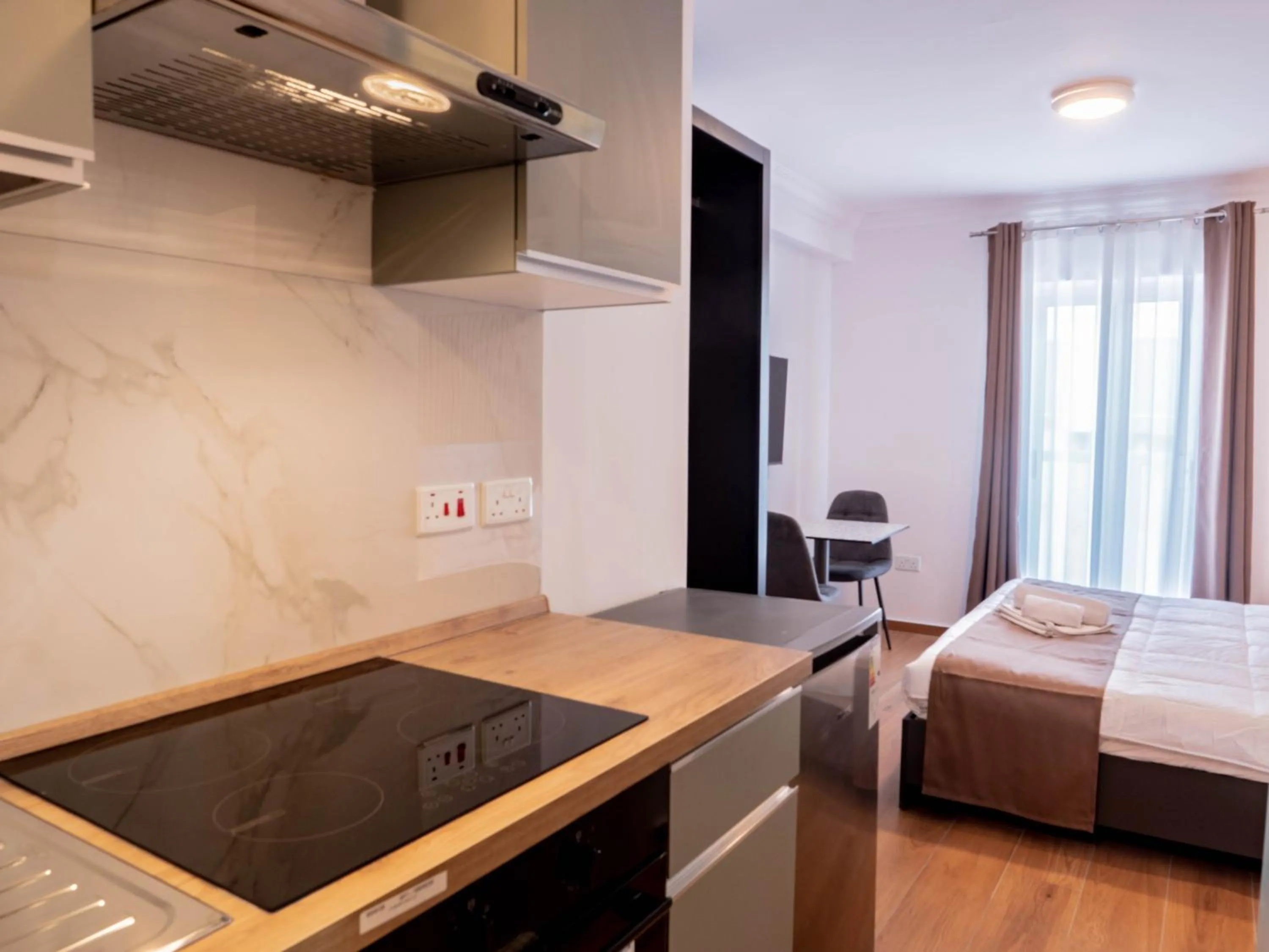 kitchen, Bed in Marina Suites & apartments - Self catering - by Tritoni hotels