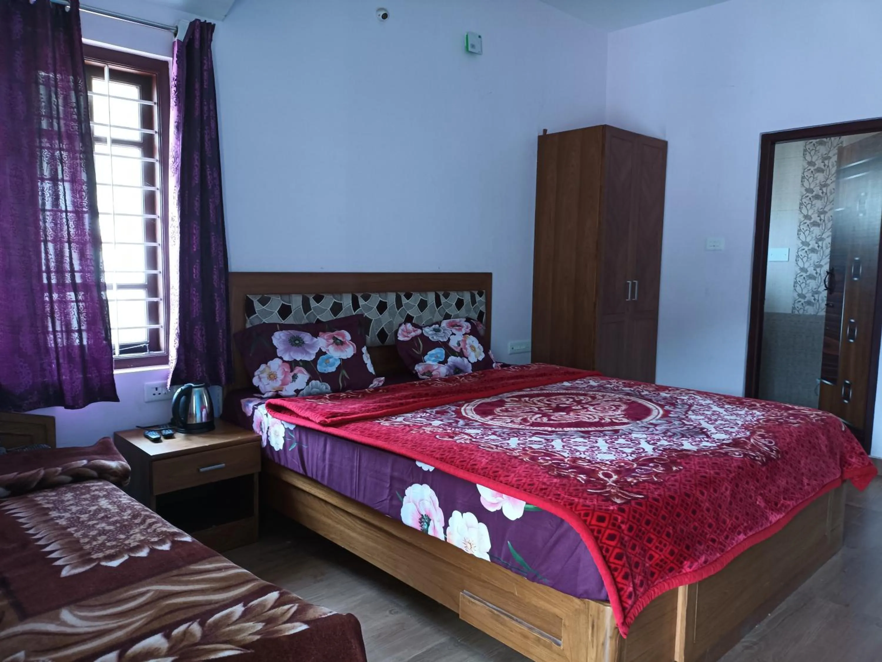 Bedroom, Bed in Karpagam Residency