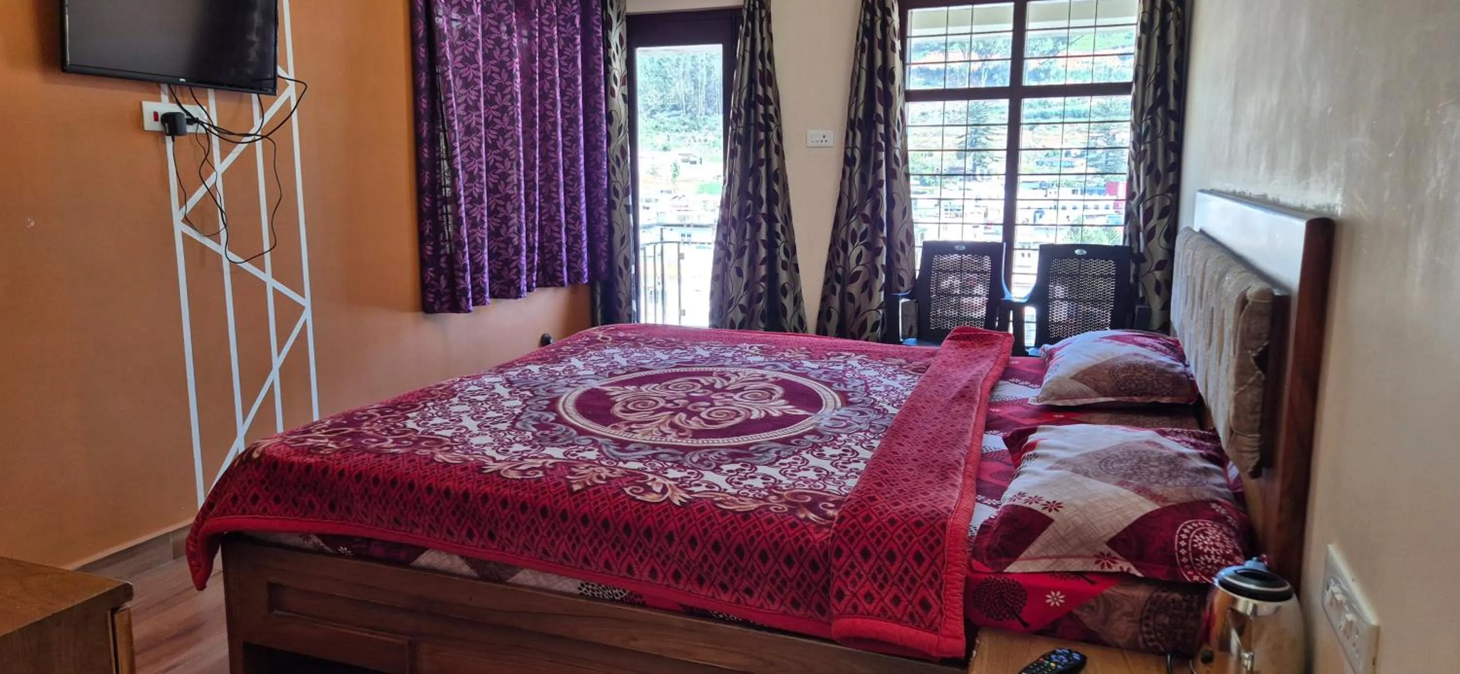 Bedroom, Bed in Karpagam Residency