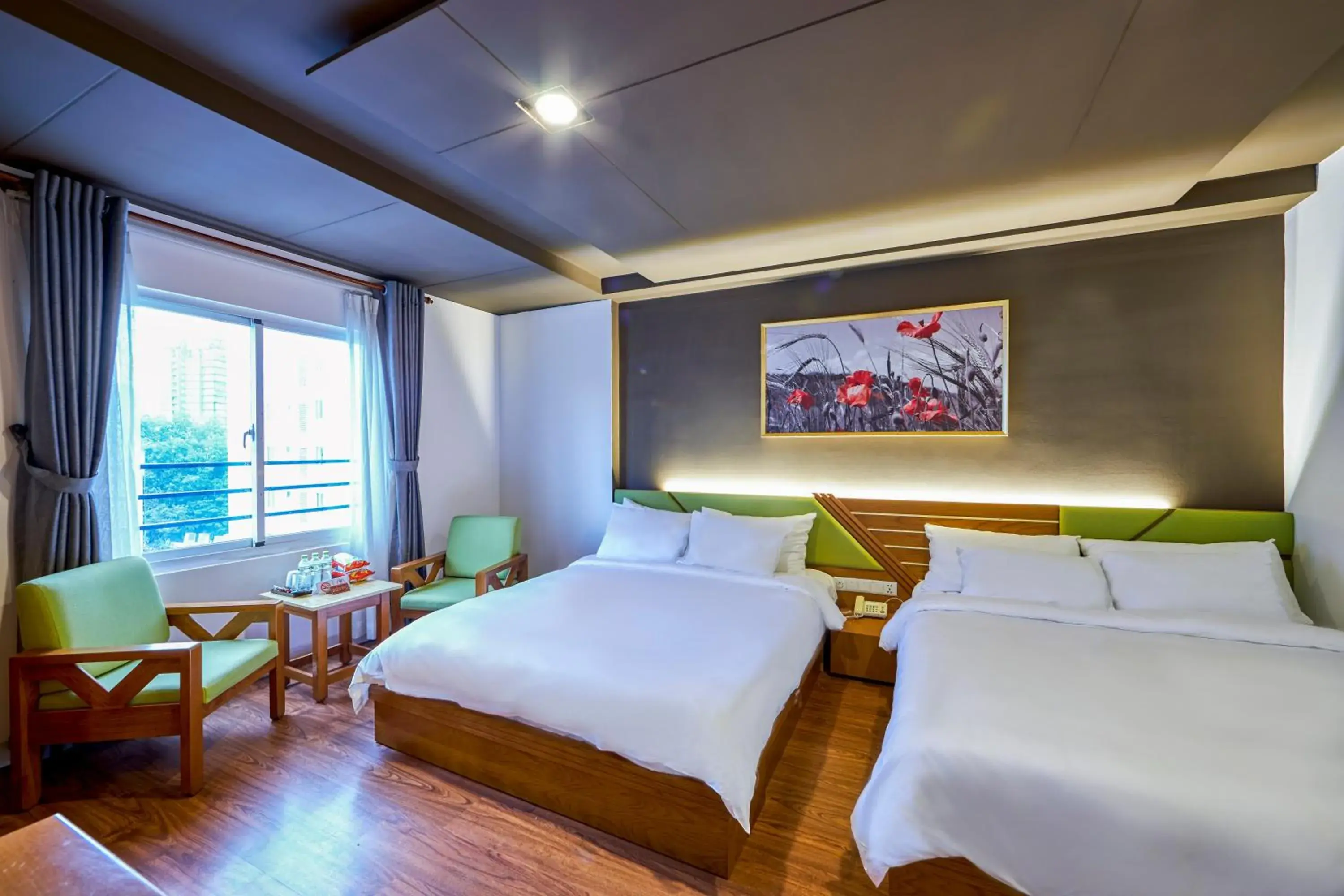 Family Room with complimentary daily snack in The Noble Swan Hotel Saigon Family Room with complimentary daily snack in The Noble Swan Hotel Saigon