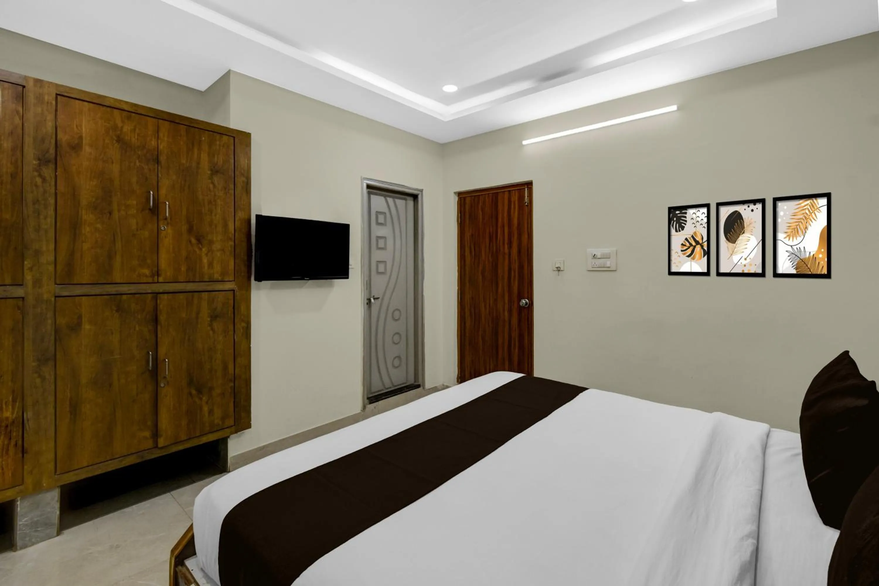 Bedroom, Bed in Townhouse Financial District Gachibowli Formerly Srinika Inn