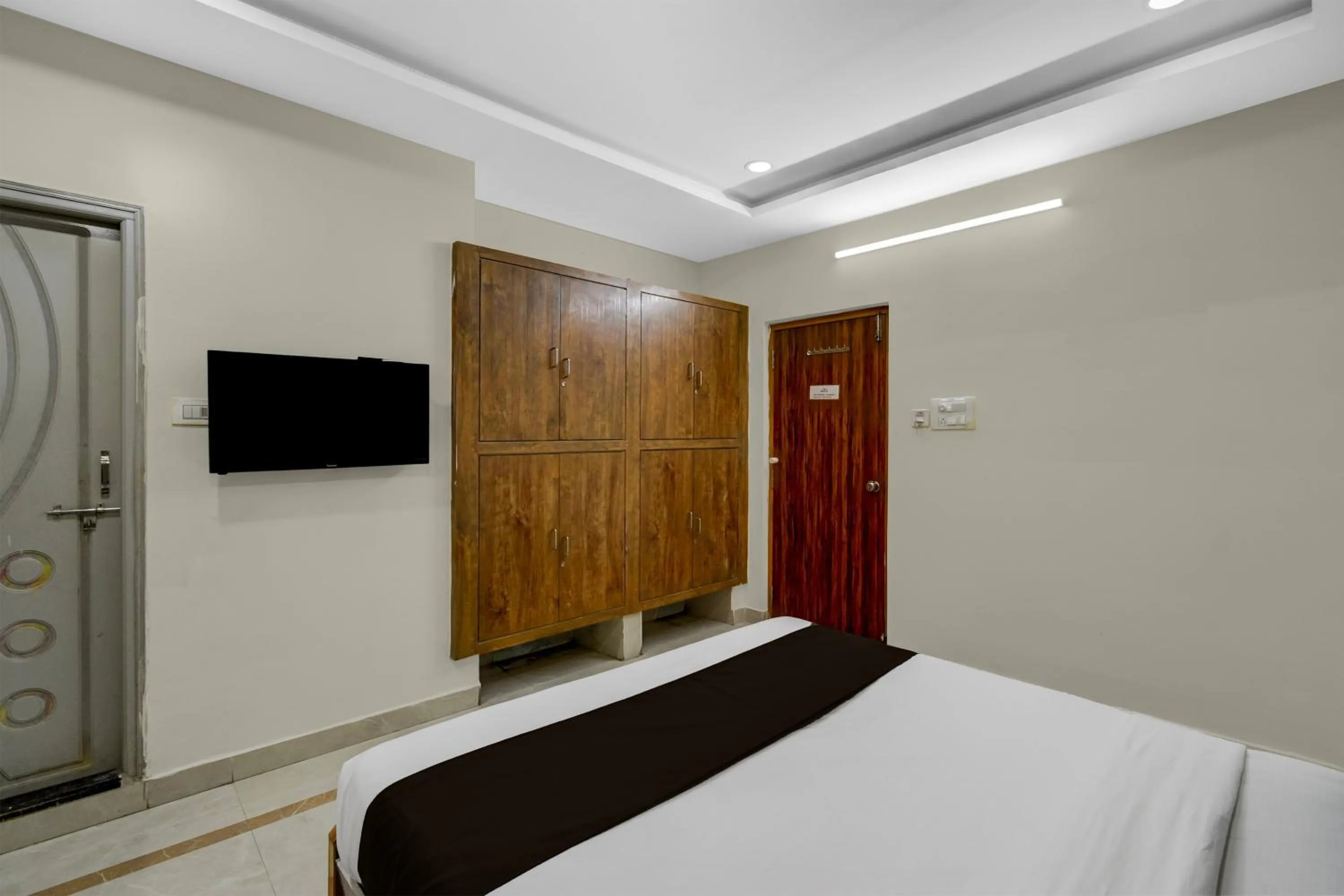 Bedroom, Bed in Townhouse Financial District Gachibowli Formerly Srinika Inn