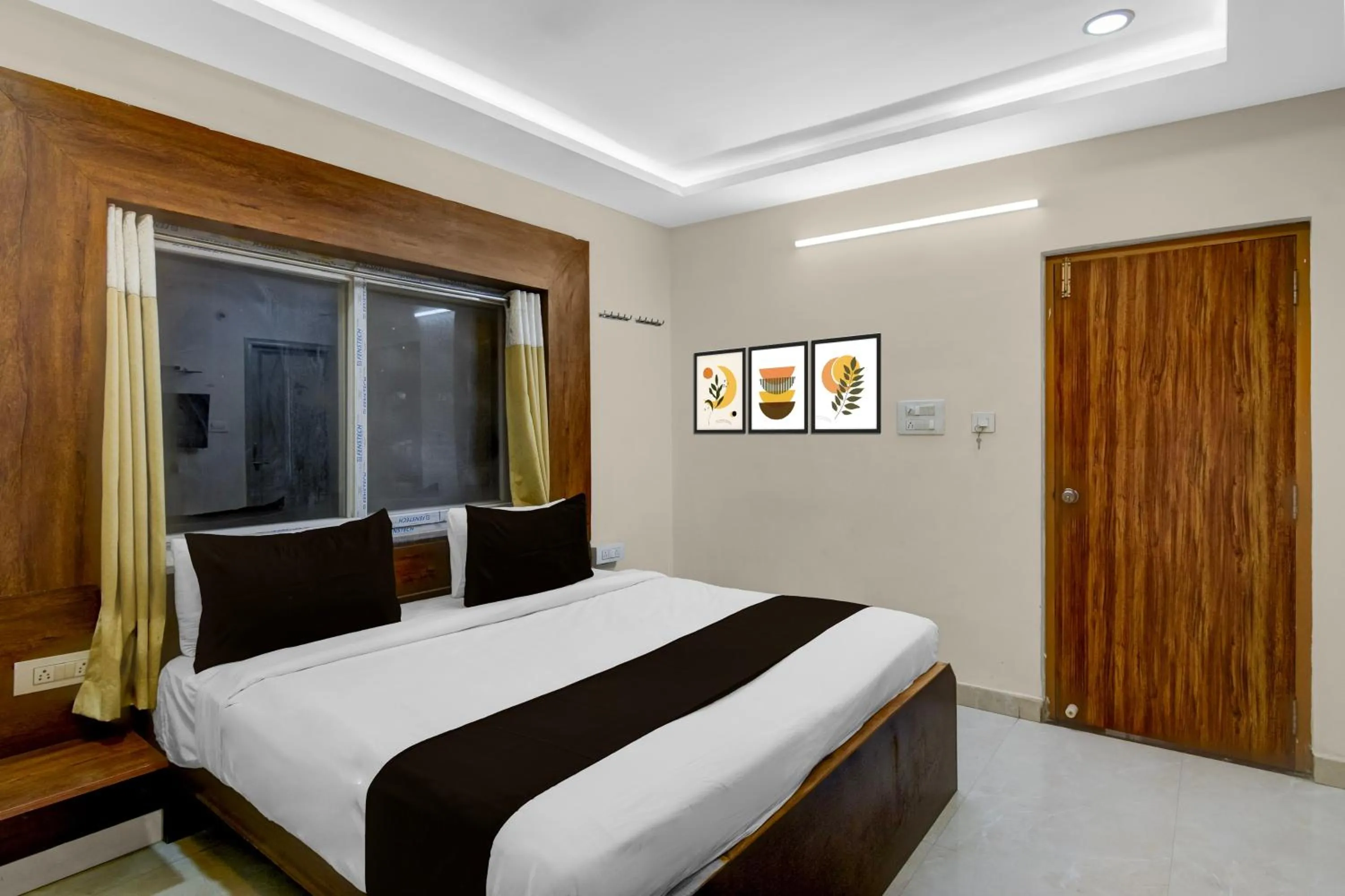 Bedroom, Bed in Townhouse Financial District Gachibowli Formerly Srinika Inn