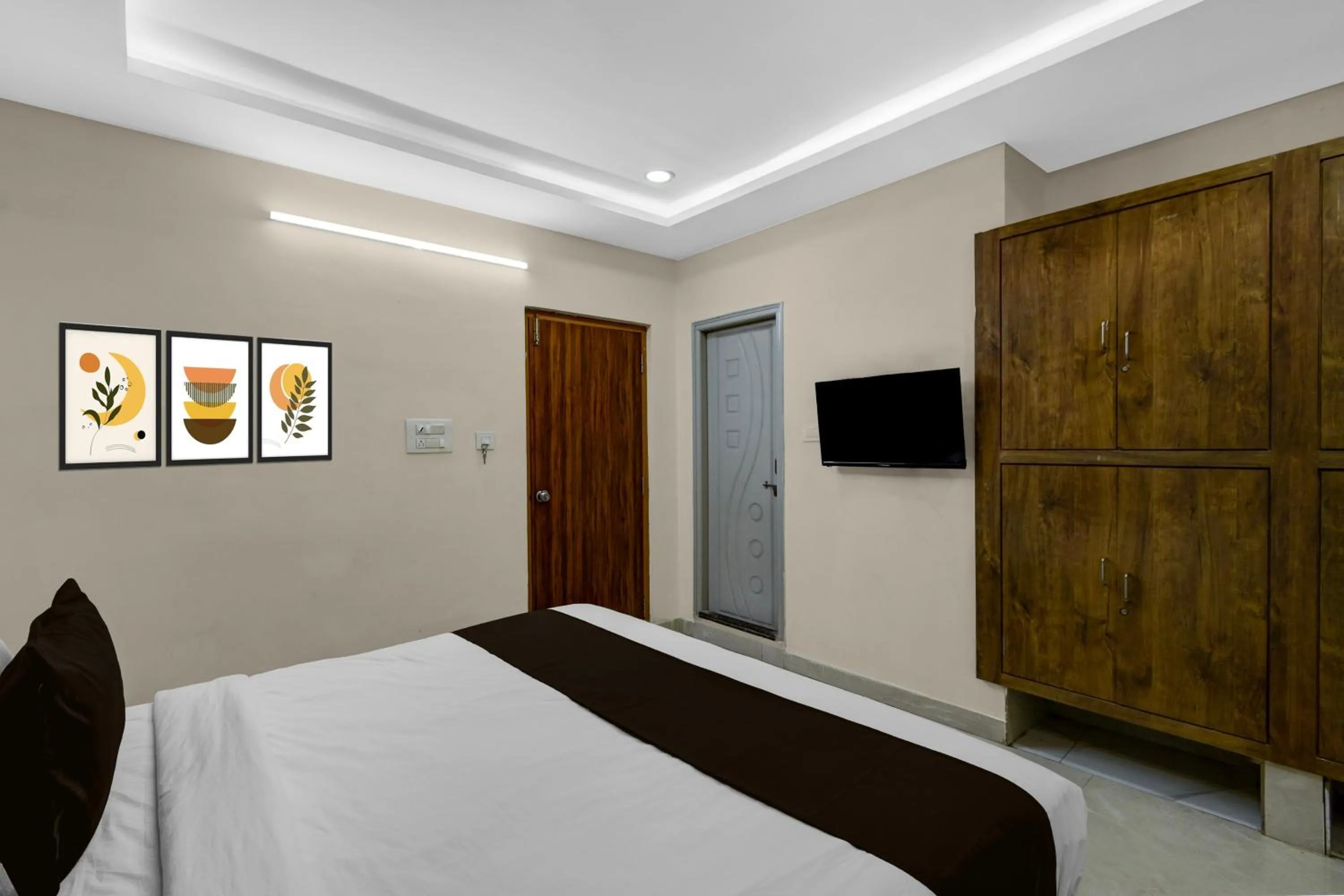 Bedroom, Bed in Townhouse Financial District Gachibowli Formerly Srinika Inn