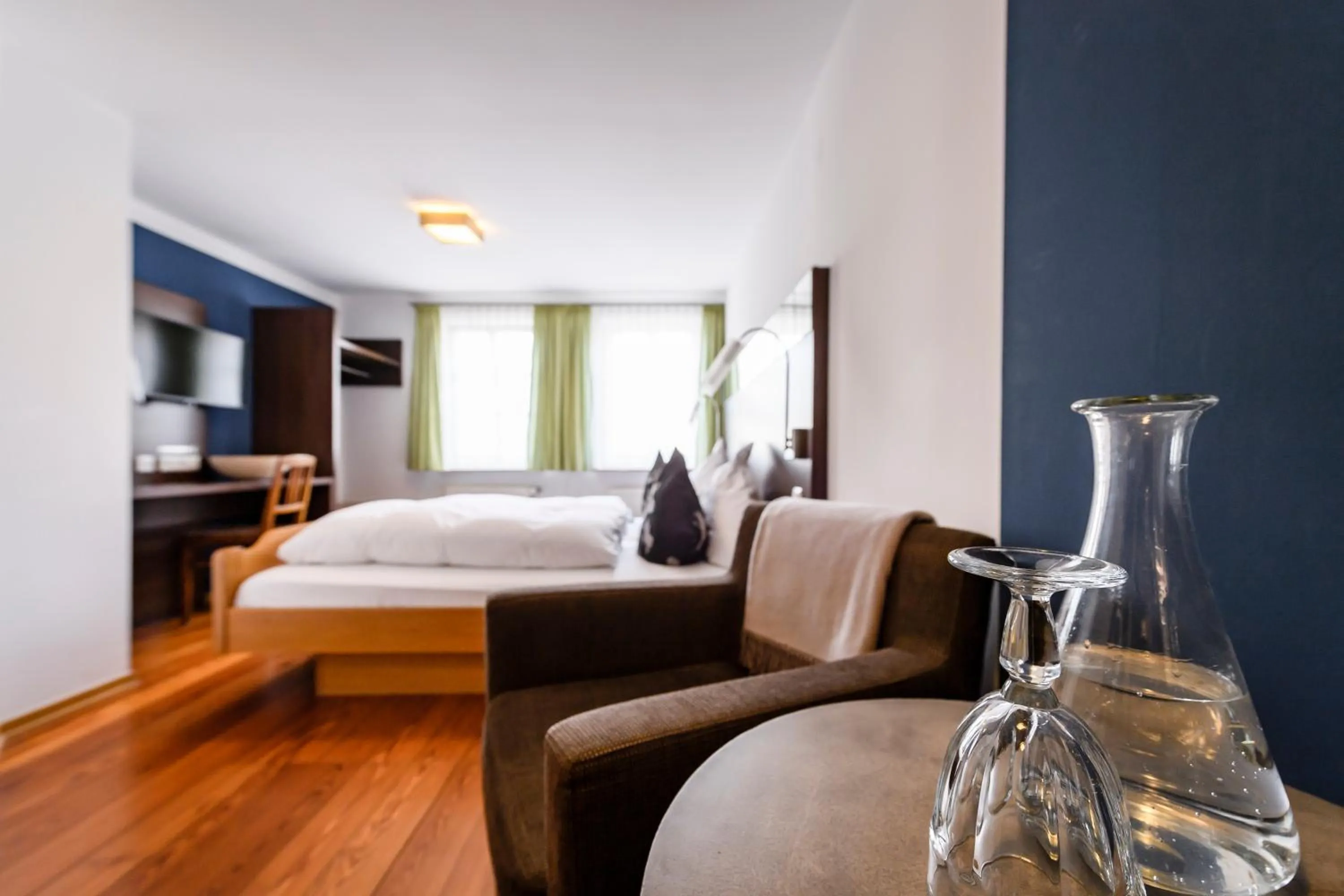 Seating area, Bed in Hotel Bären