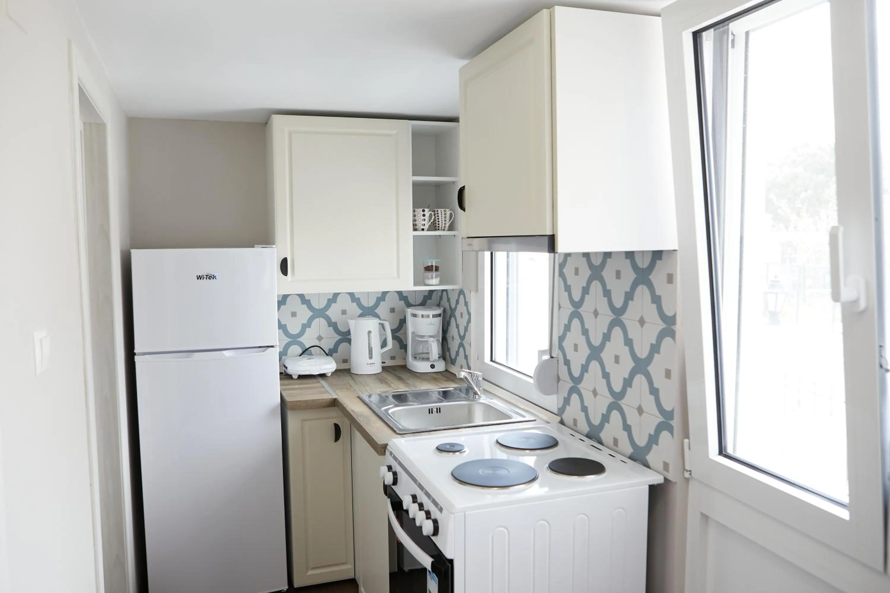 Kitchen or kitchenette in Romilia Guesthouse