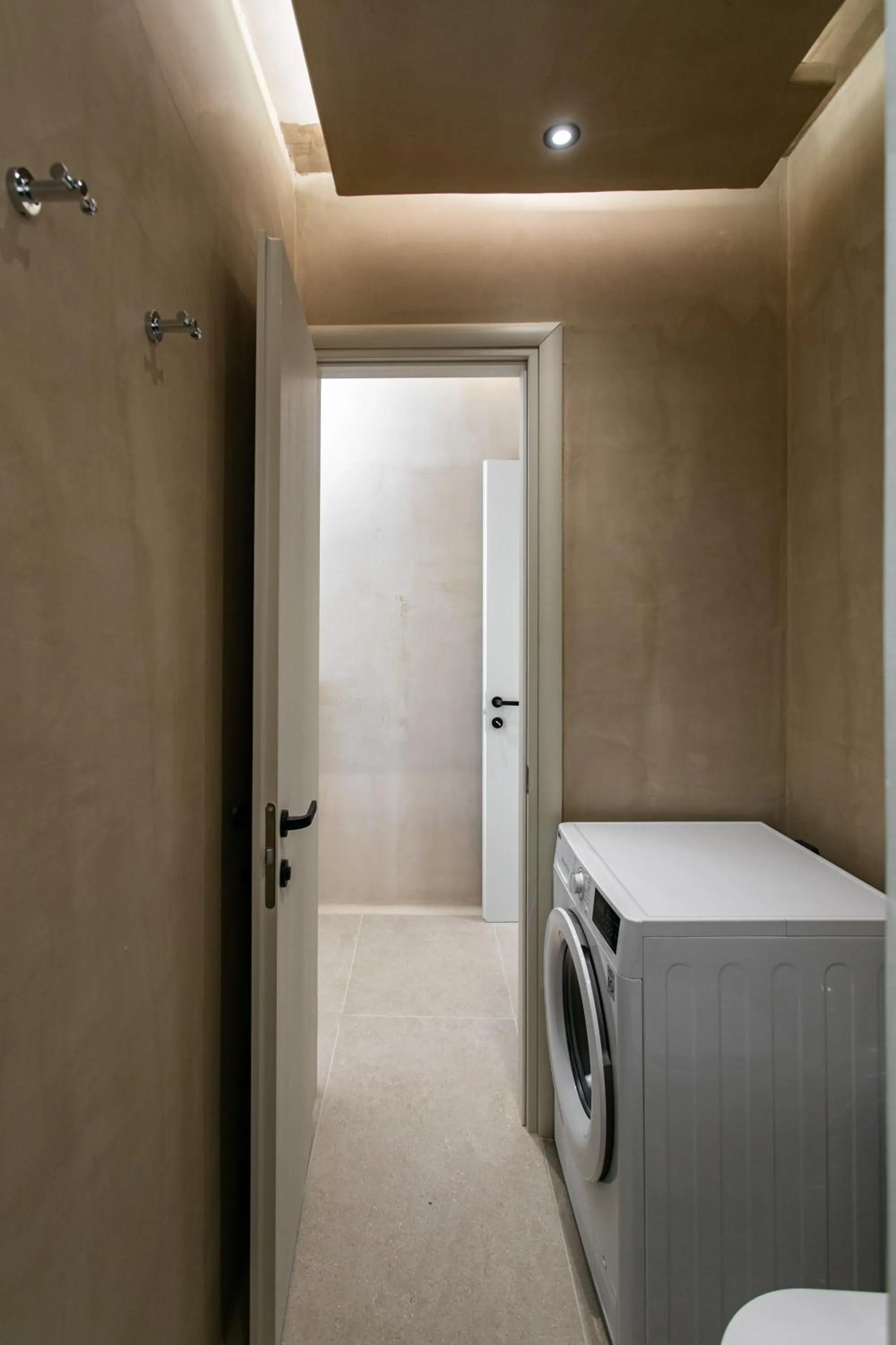 washing machine in Eden Beachfront Residences & Suites