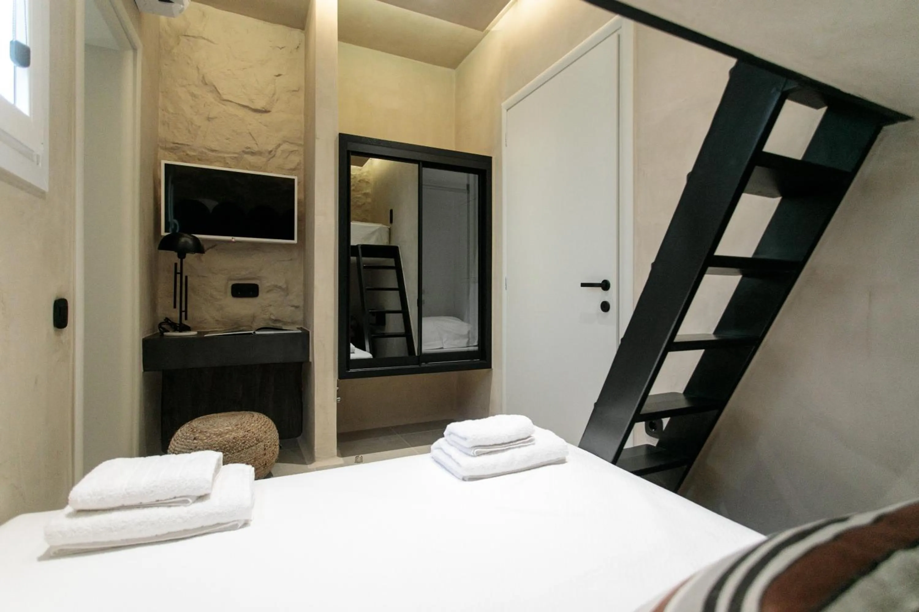 Bed in Eden Beachfront Residences & Suites
