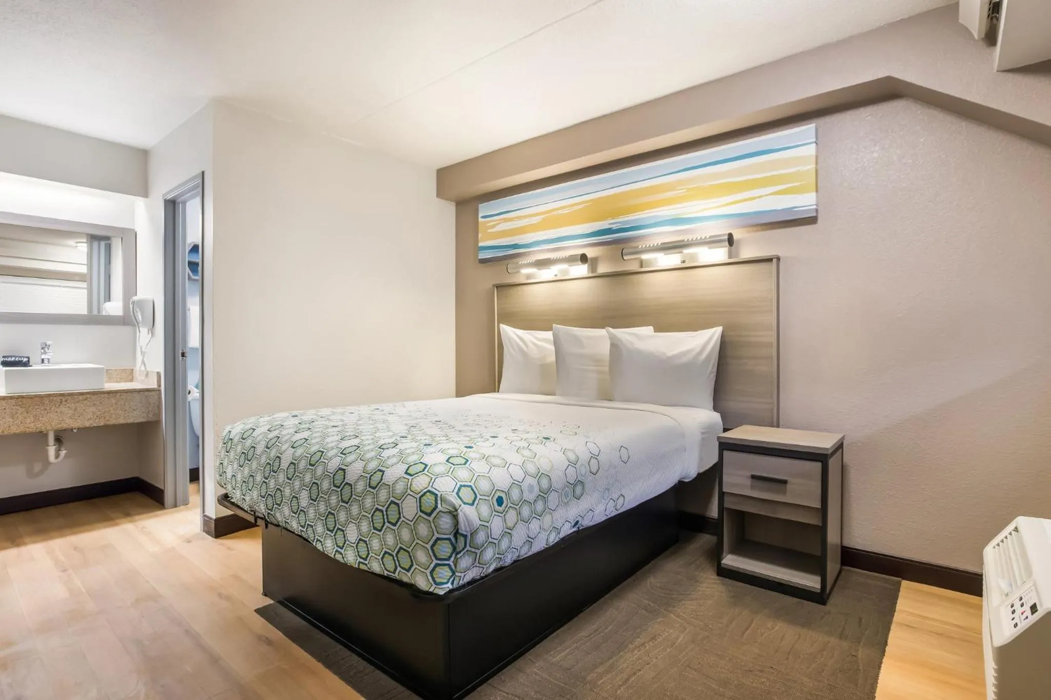 Bedroom, Bed in HomeTowne Studios by Red Roof Princeton - Ewing/ Lawrenceville