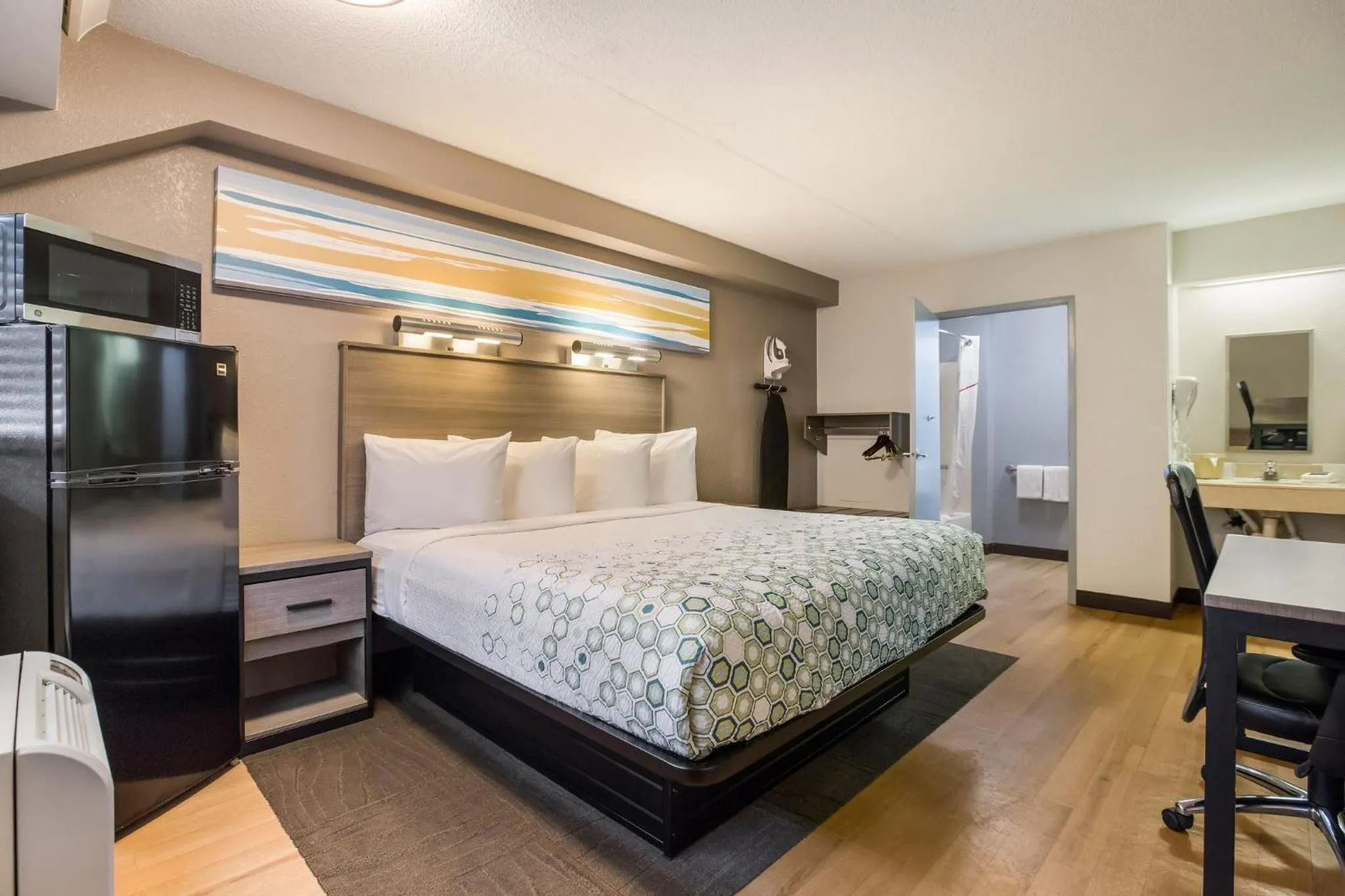 Bedroom, Bed in HomeTowne Studios by Red Roof Princeton - Ewing/ Lawrenceville