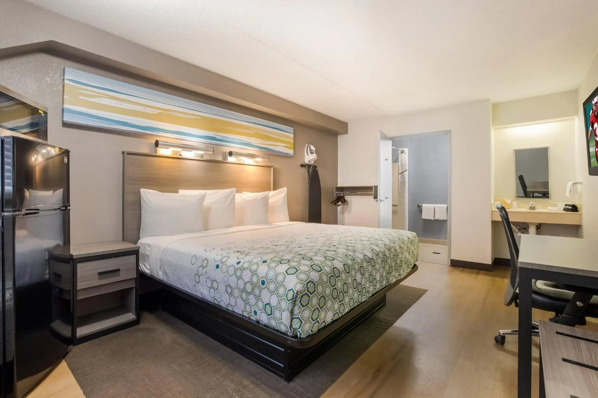 Bedroom, Bed in HomeTowne Studios by Red Roof Princeton - Ewing/ Lawrenceville