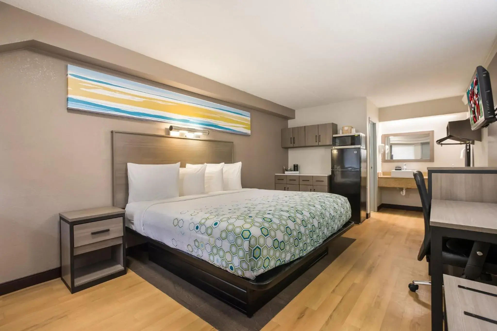 Bedroom, Bed in HomeTowne Studios by Red Roof Princeton - Ewing/ Lawrenceville Bedroom, Bed in HomeTowne Studios by Red Roof Princeton - Ewing/ Lawrenceville