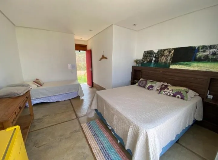 Photo of the whole room, Bed in Espelho D'Água Pousada - Capitólio