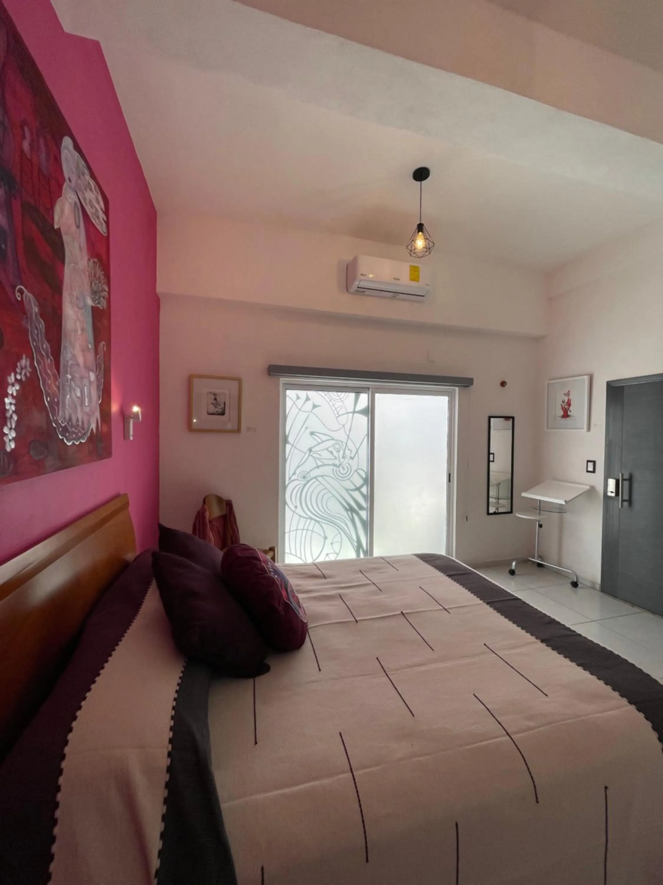 Bed in LARIMAR Gallery y Hotel Boutique