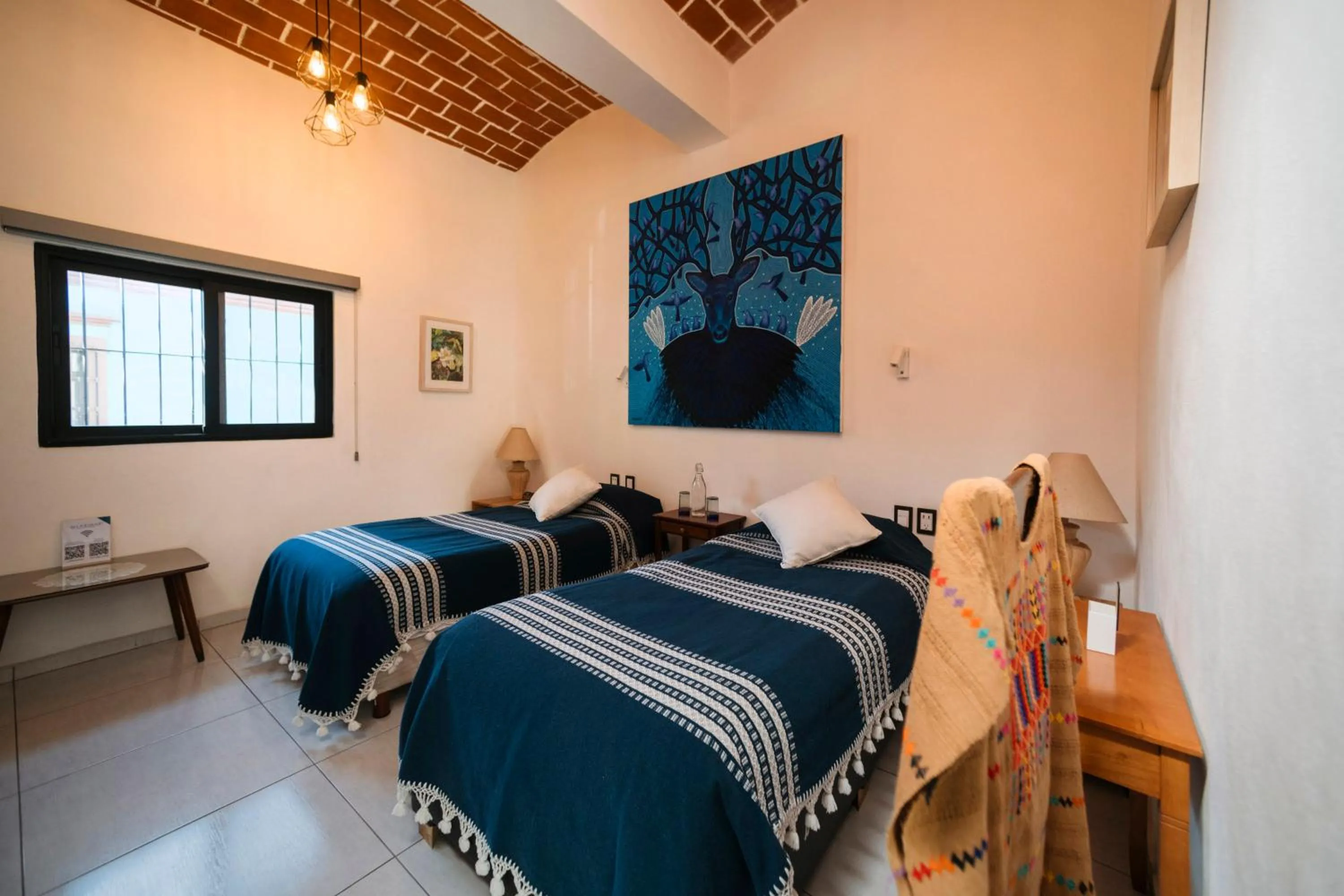 Bed in LARIMAR Gallery y Hotel Boutique