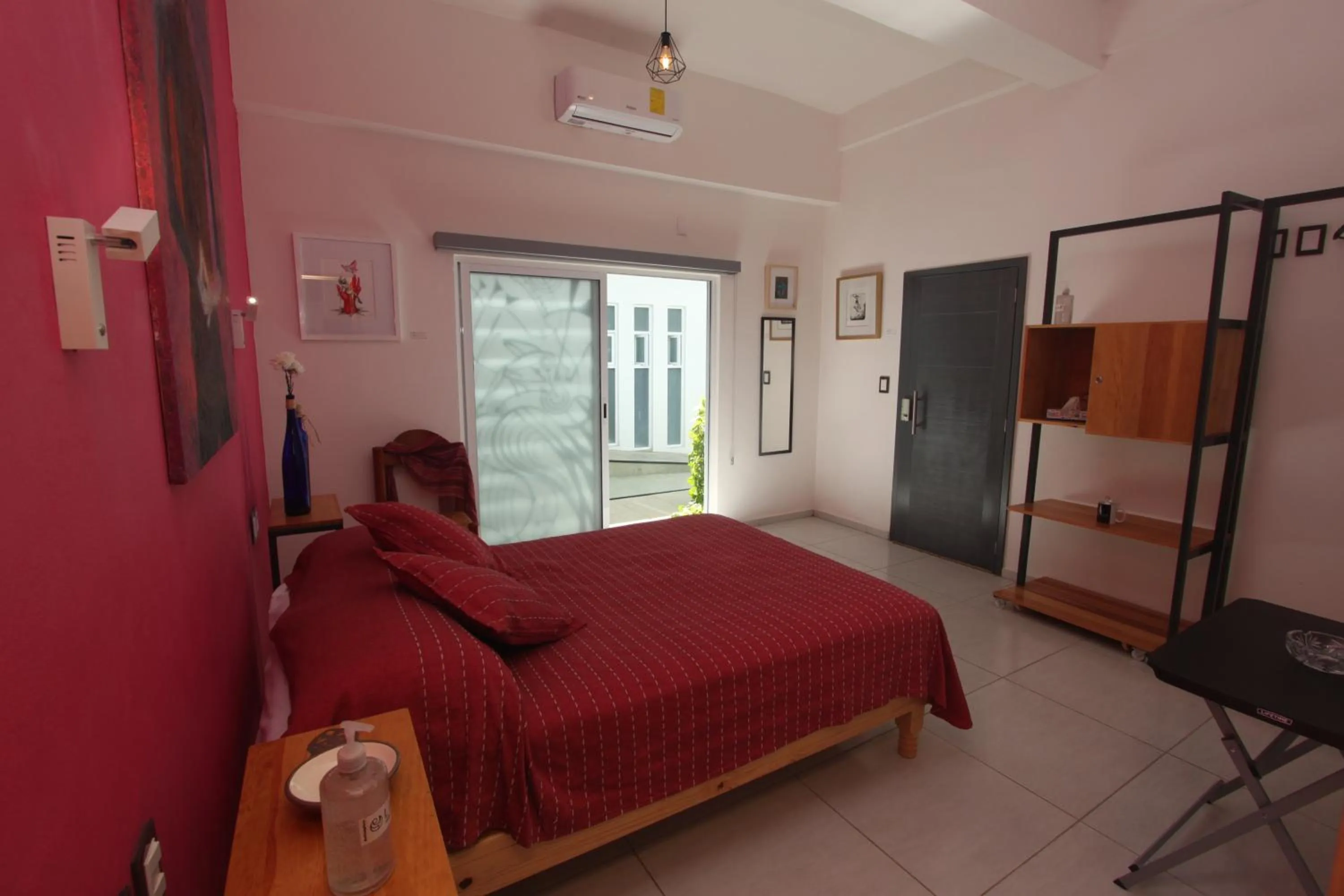 air conditioner, Bed in LARIMAR Gallery y Hotel Boutique