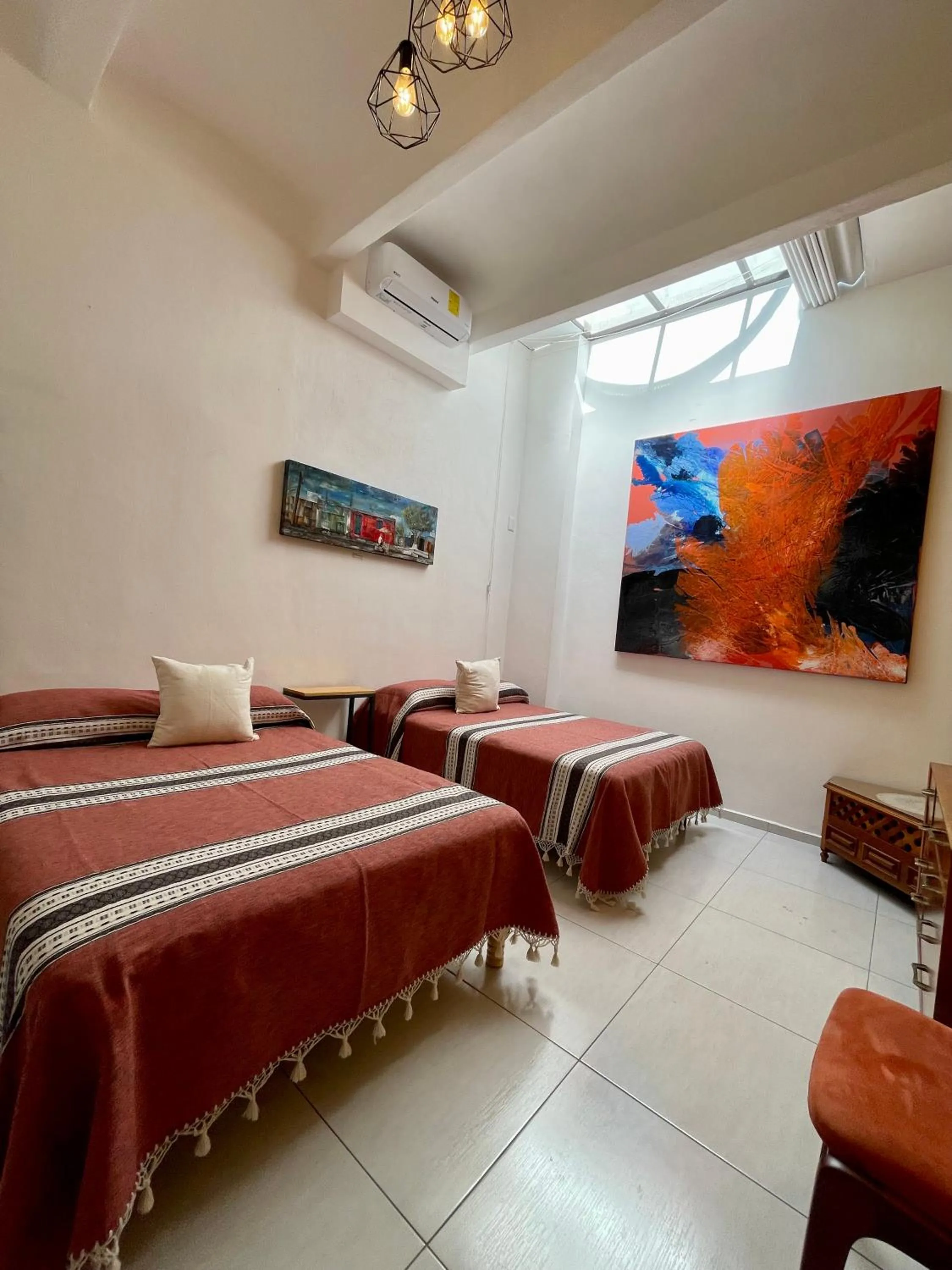 Bed in LARIMAR Gallery y Hotel Boutique