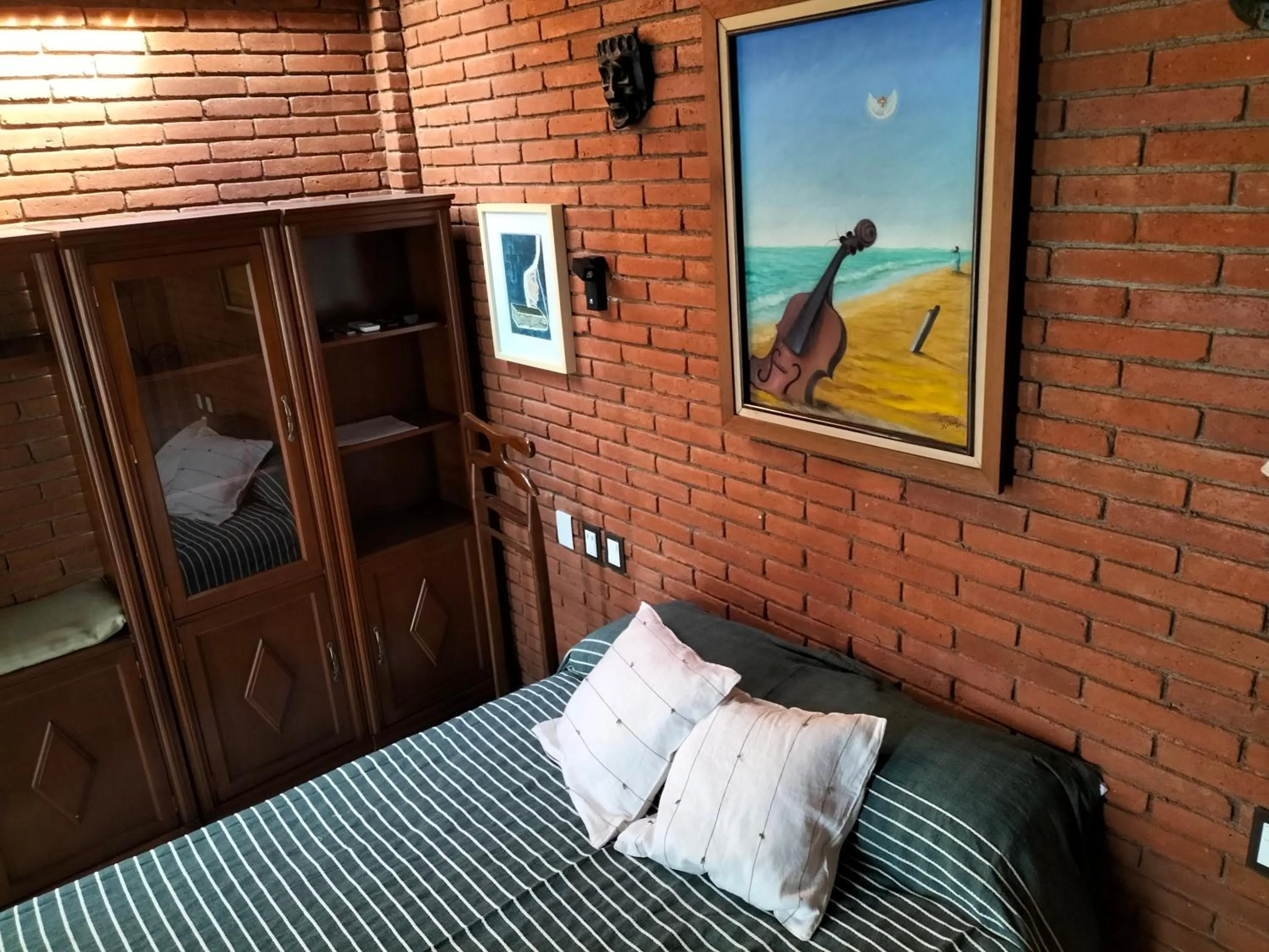 Bed in LARIMAR Gallery y Hotel Boutique