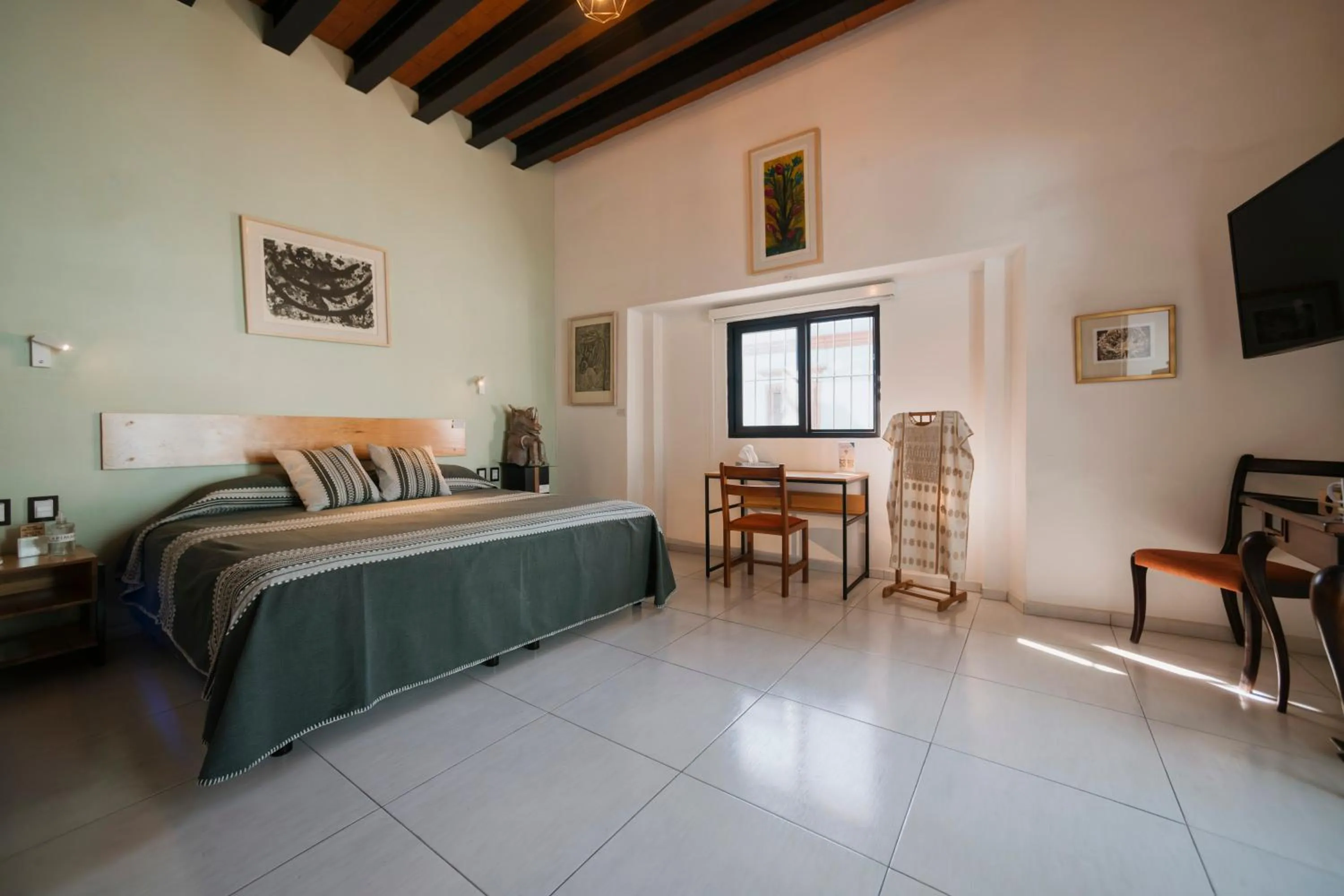 Bed in LARIMAR Gallery y Hotel Boutique