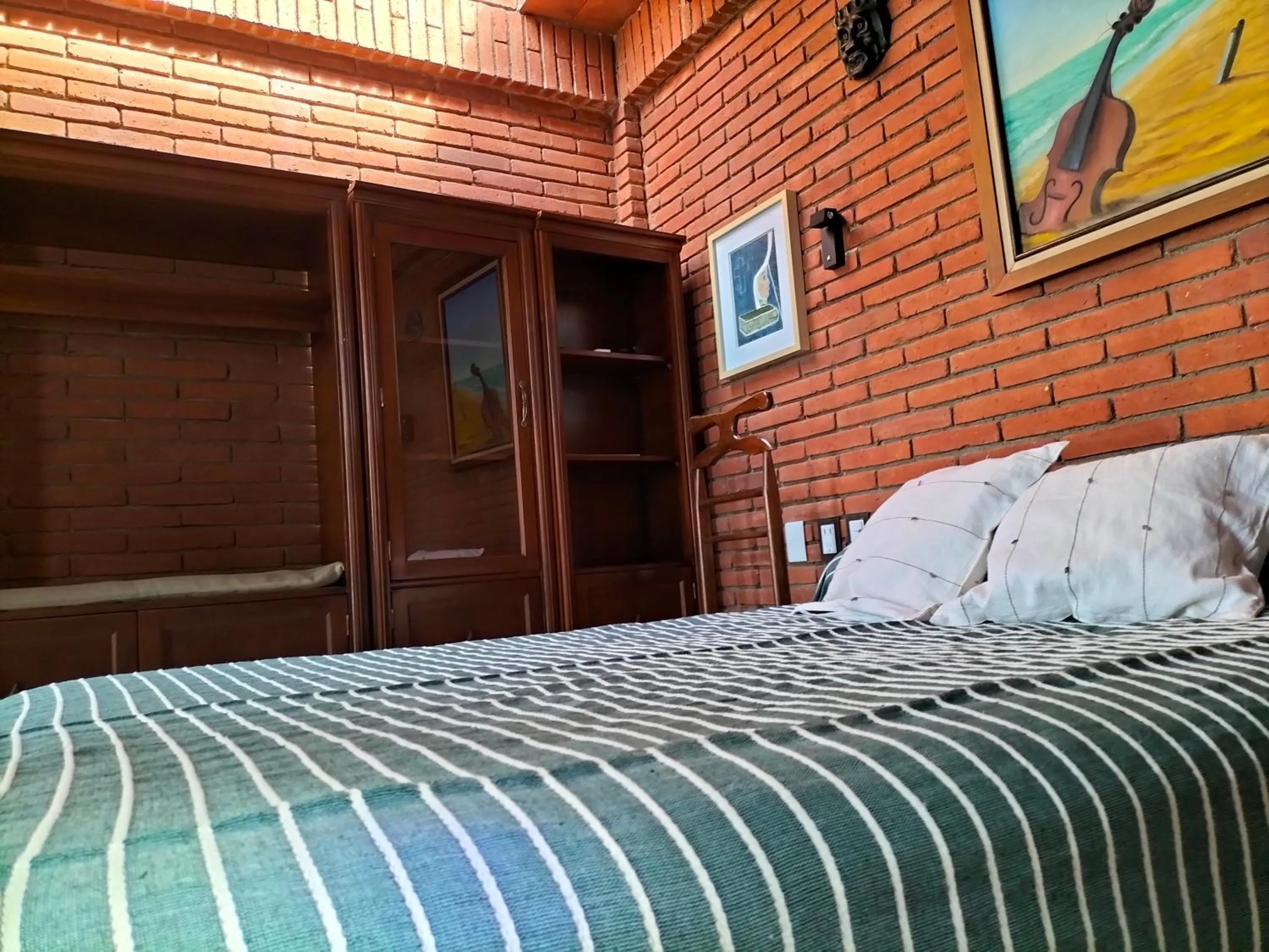 Bed in LARIMAR Gallery y Hotel Boutique