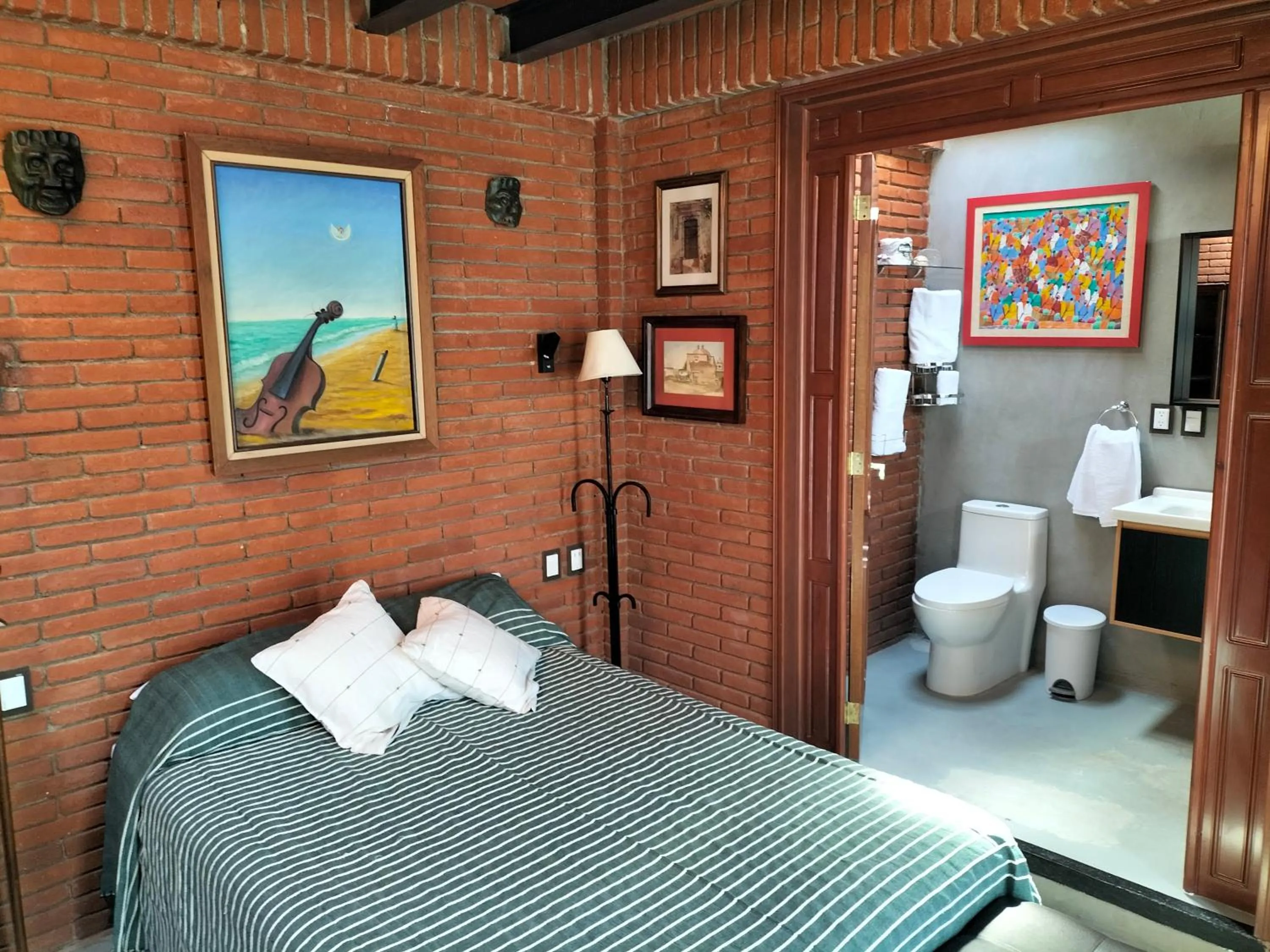 Bed in LARIMAR Gallery y Hotel Boutique