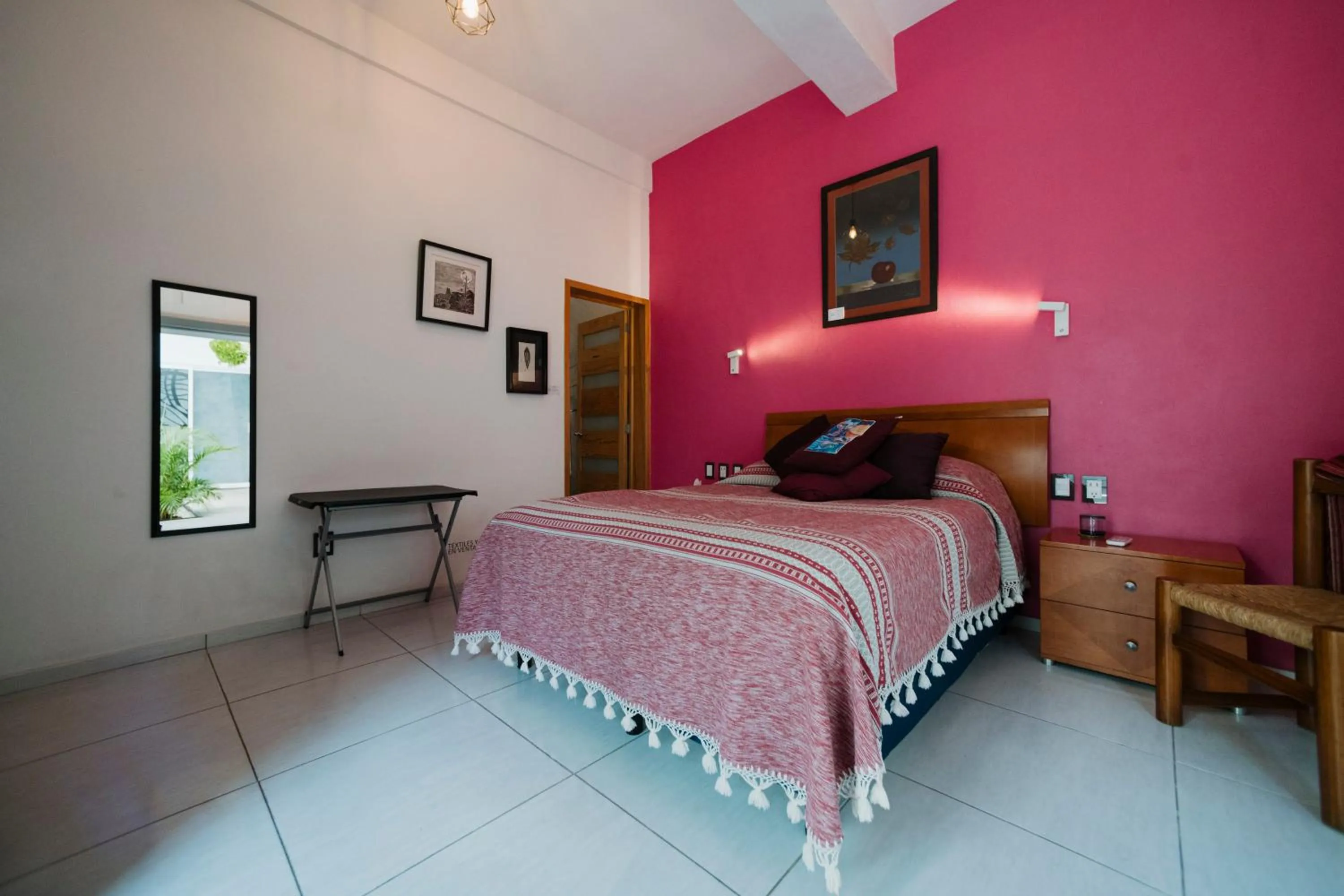 Bed in LARIMAR Gallery y Hotel Boutique