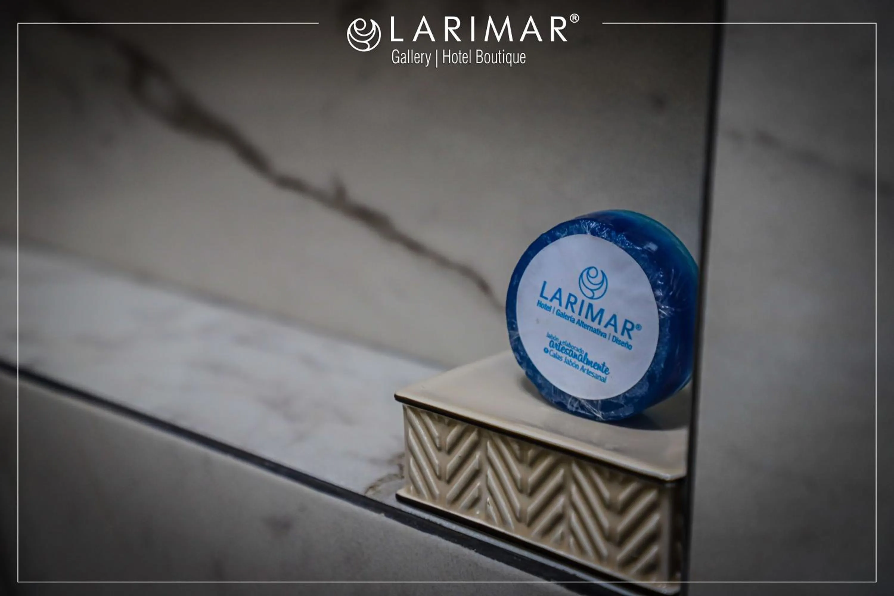 Property logo or sign in LARIMAR Gallery y Hotel Boutique