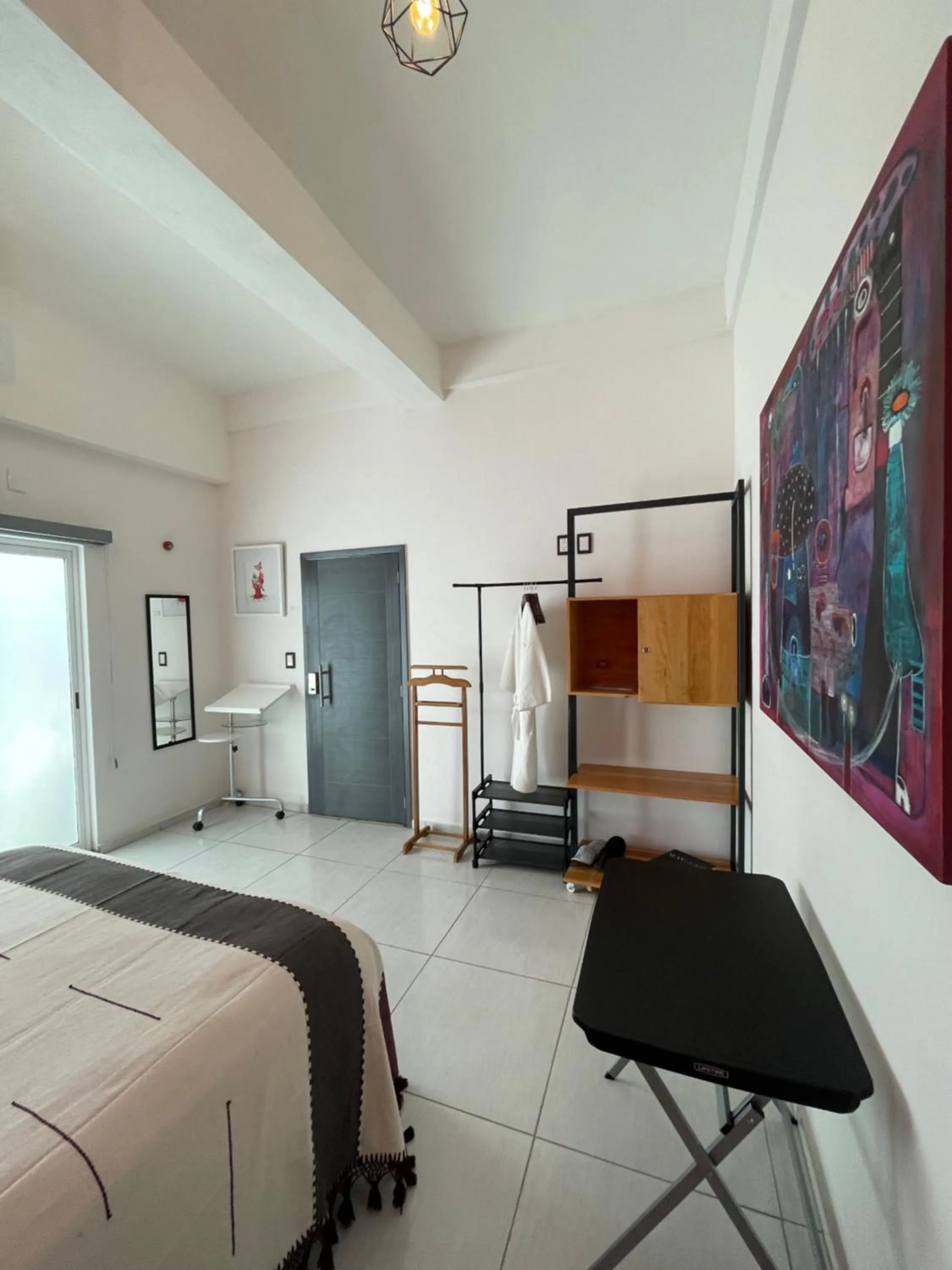 Bed in LARIMAR Gallery y Hotel Boutique