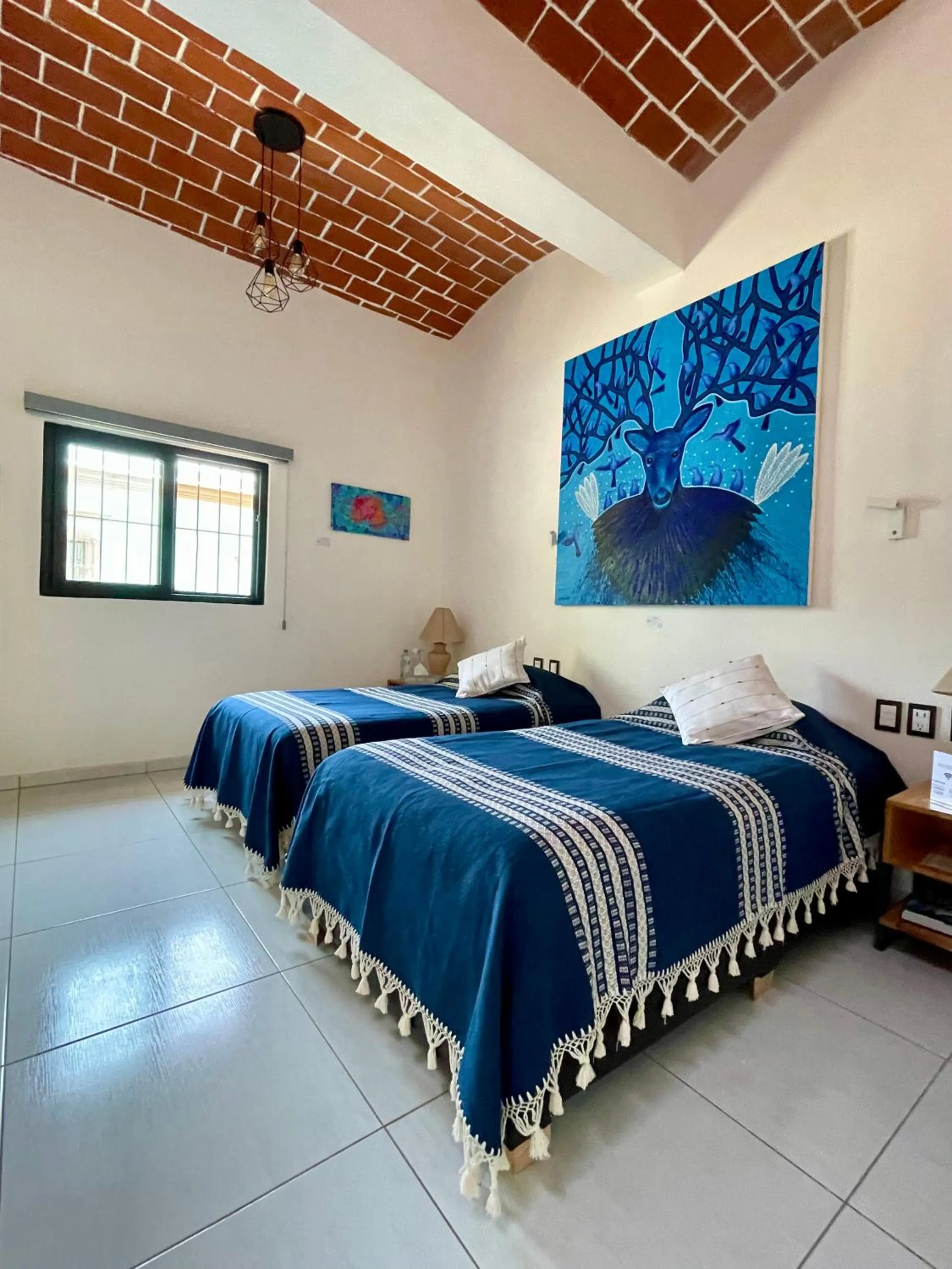 Bed in LARIMAR Gallery y Hotel Boutique