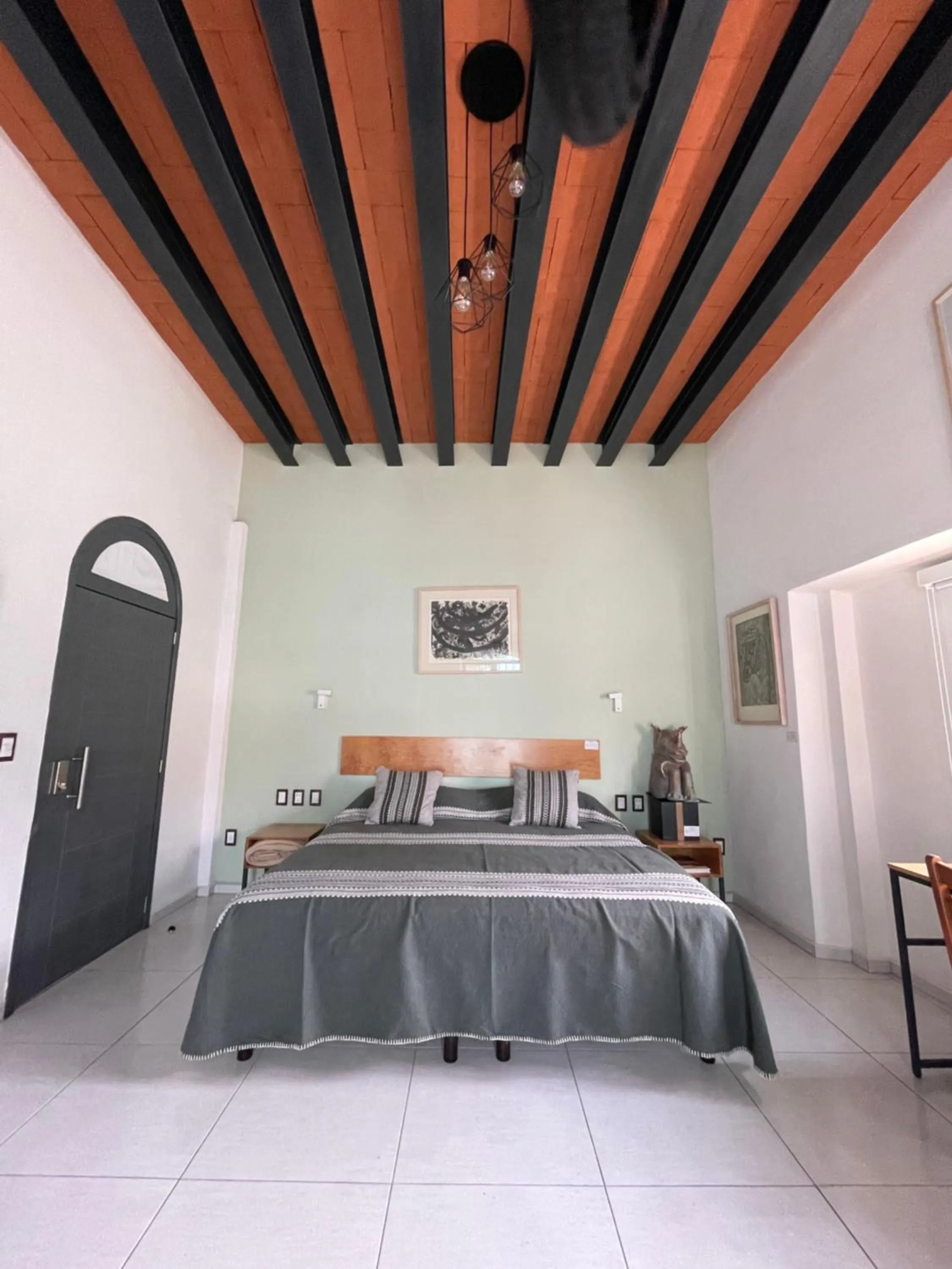 Bed in LARIMAR Gallery y Hotel Boutique