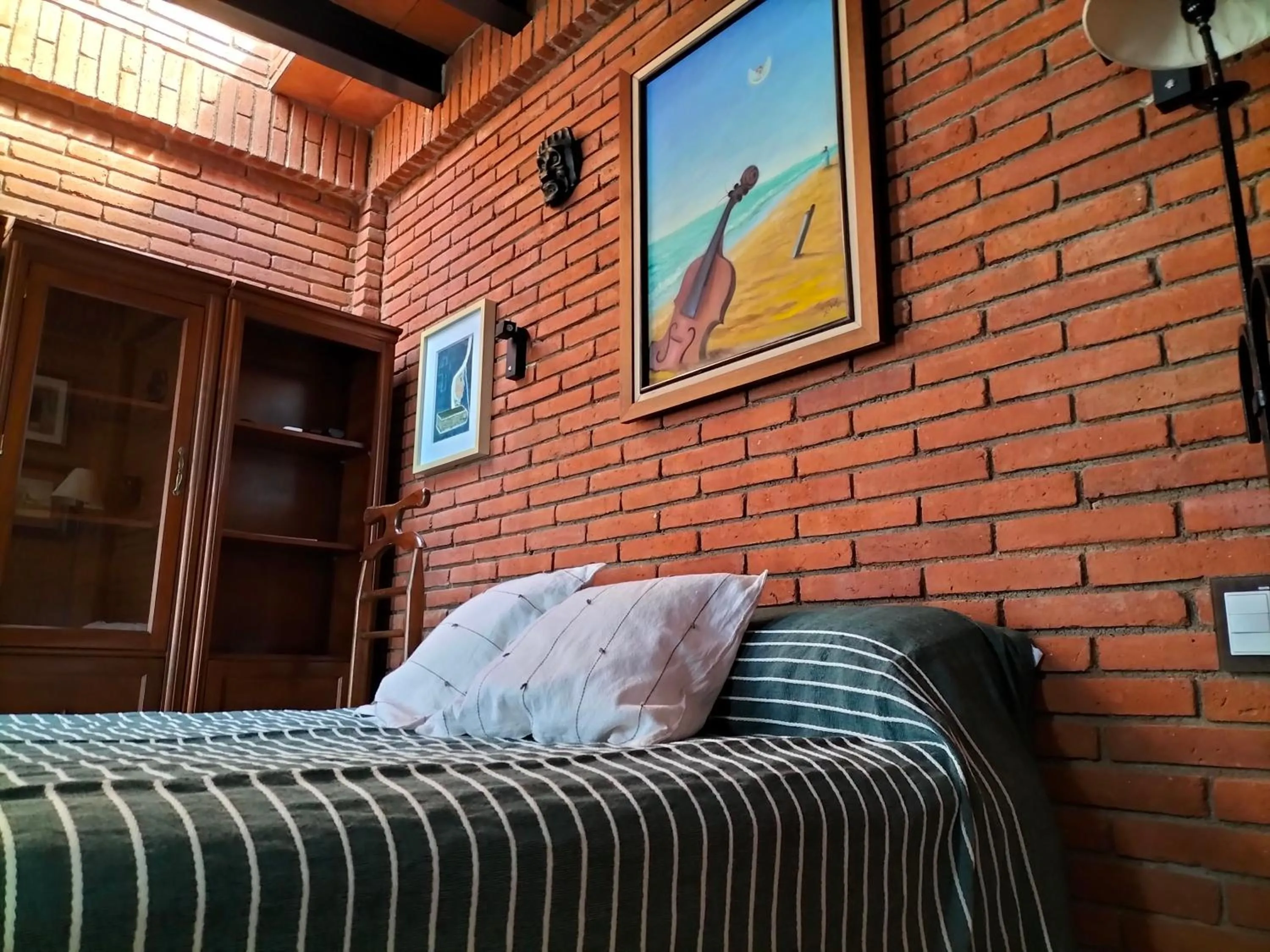 Bed in LARIMAR Gallery y Hotel Boutique