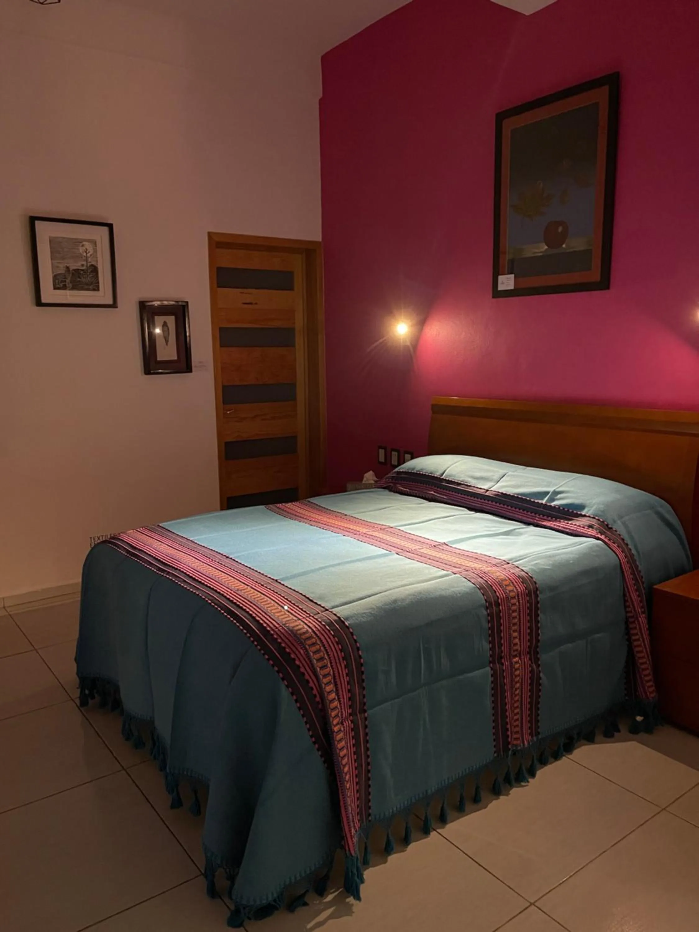 Bed in LARIMAR Gallery y Hotel Boutique