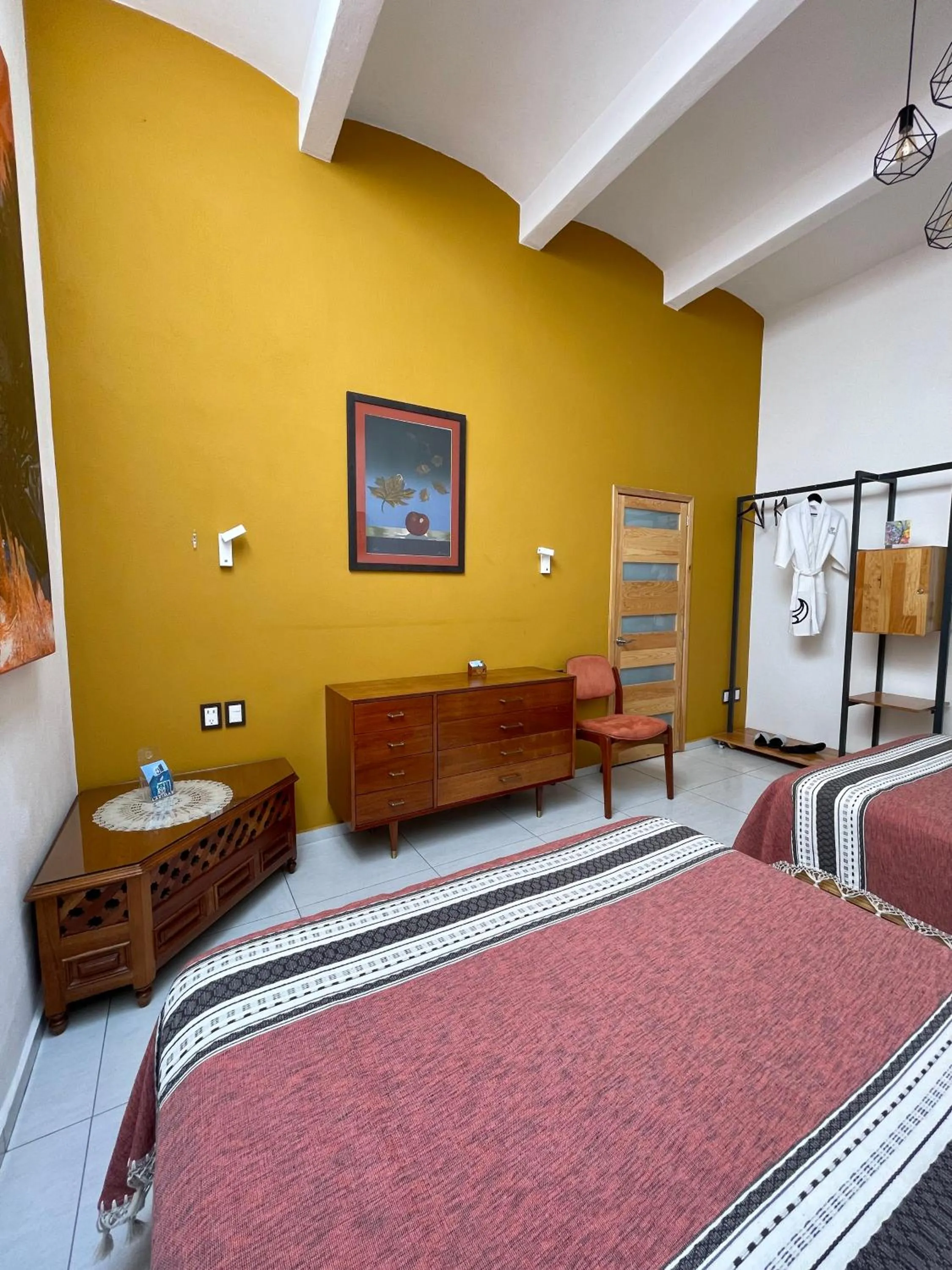 Bed in LARIMAR Gallery y Hotel Boutique