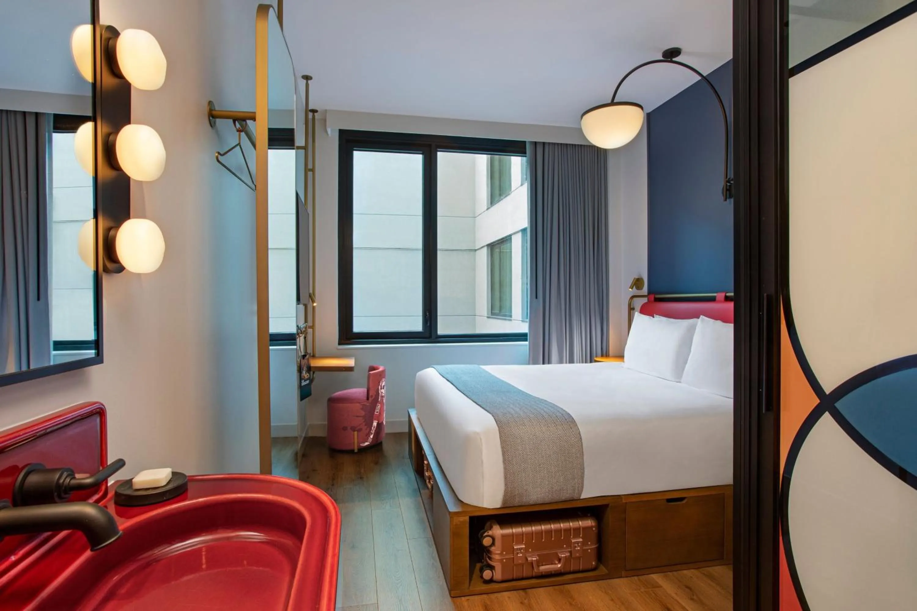Photo of the whole room, Bed in Moxy NYC Lower East Side
