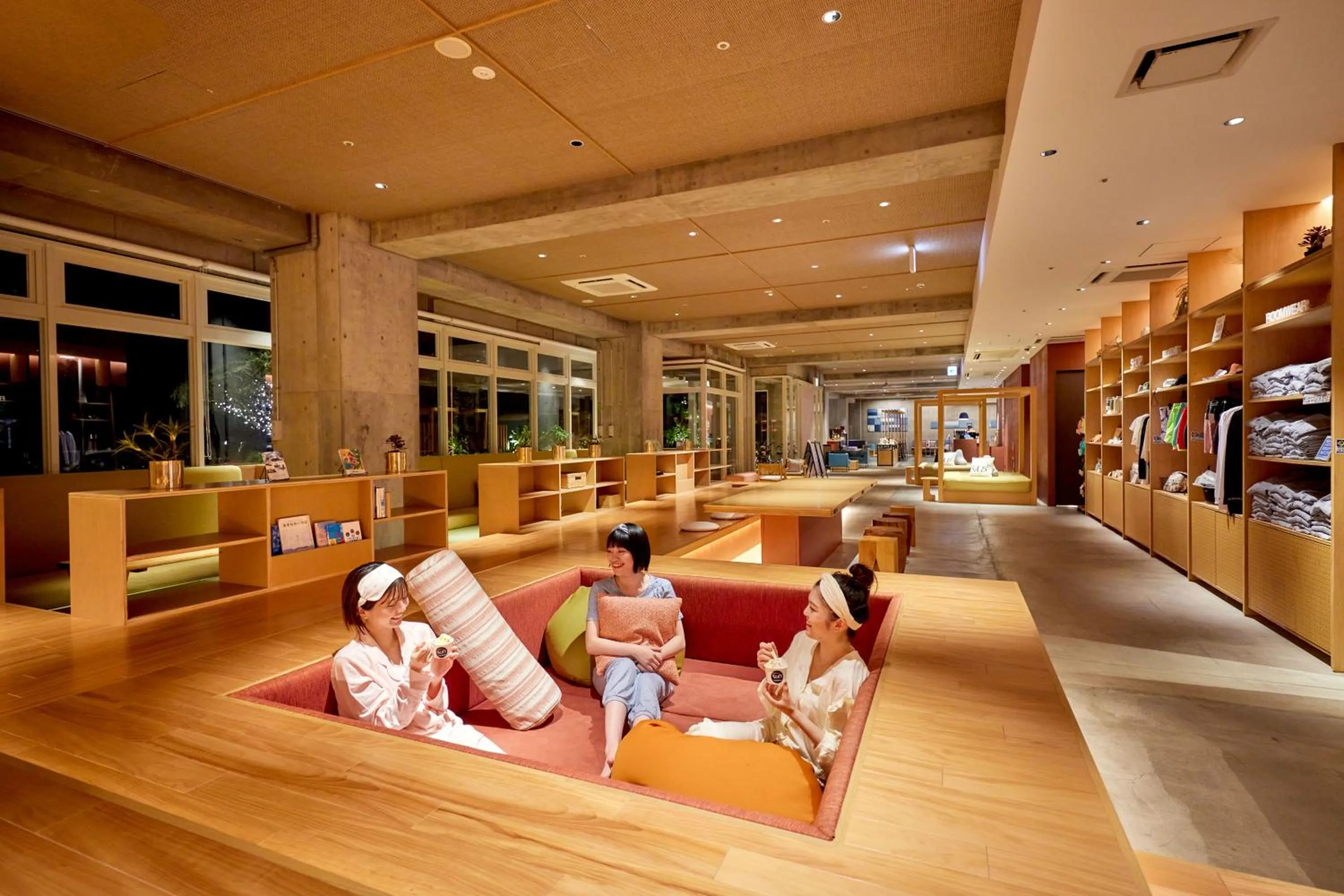 Communal lounge/ TV room in BEB5 Okinawa Seragaki by Hoshino Resorts