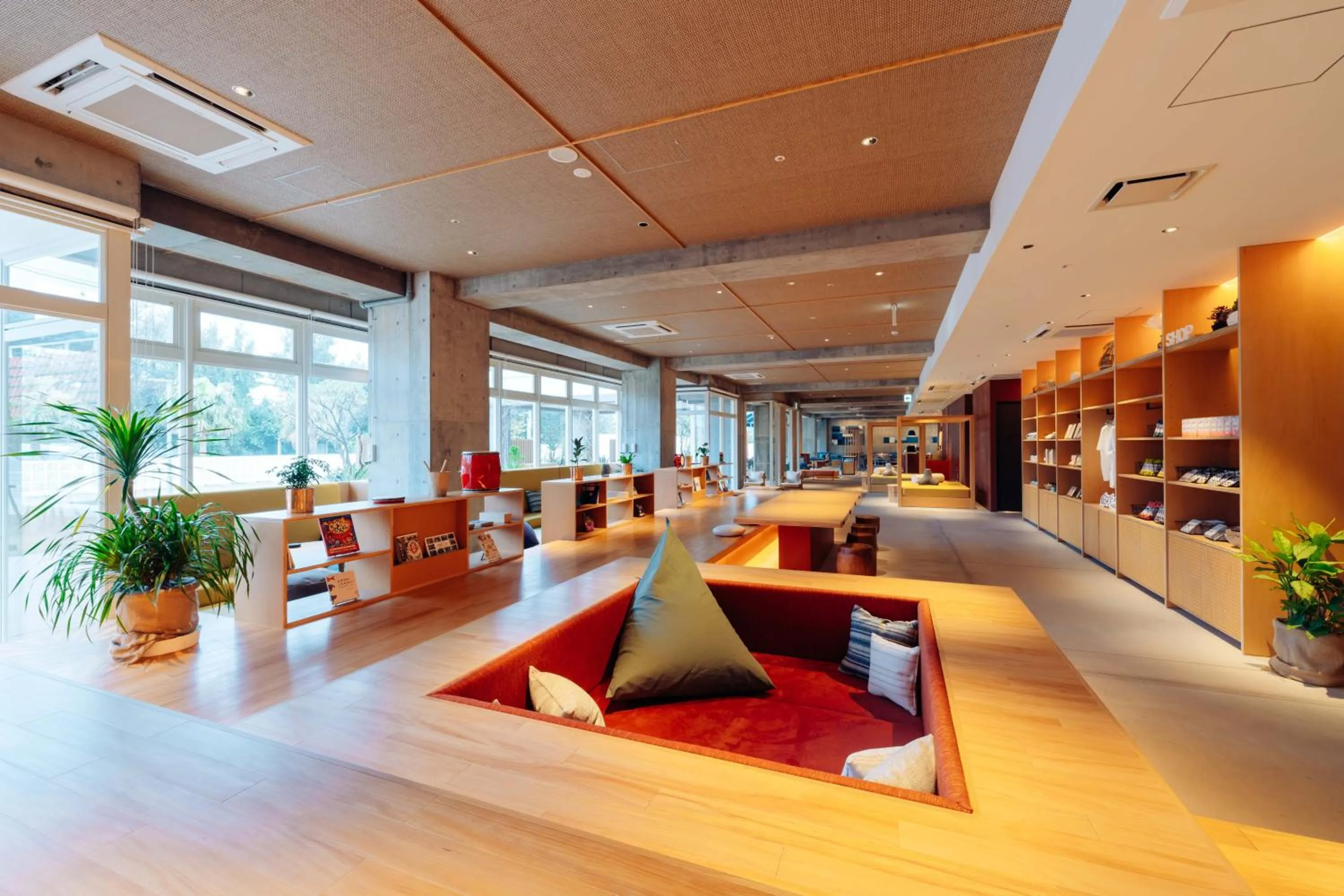 Communal lounge/ TV room in BEB5 Okinawa Seragaki by Hoshino Resorts