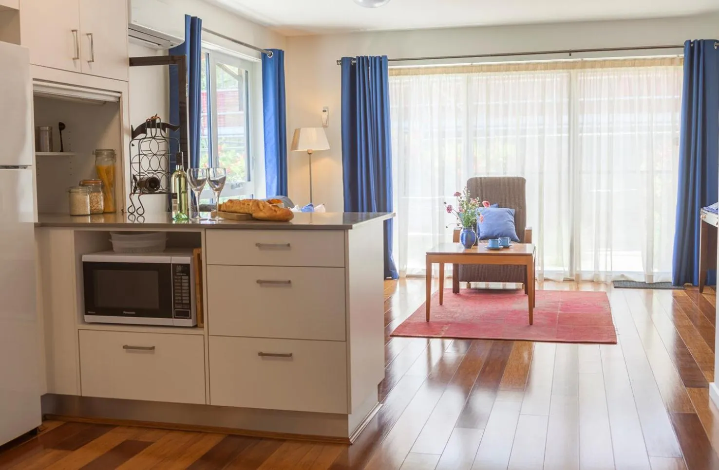 Living room, Kitchen/Kitchenette in One of a Kind Apartments