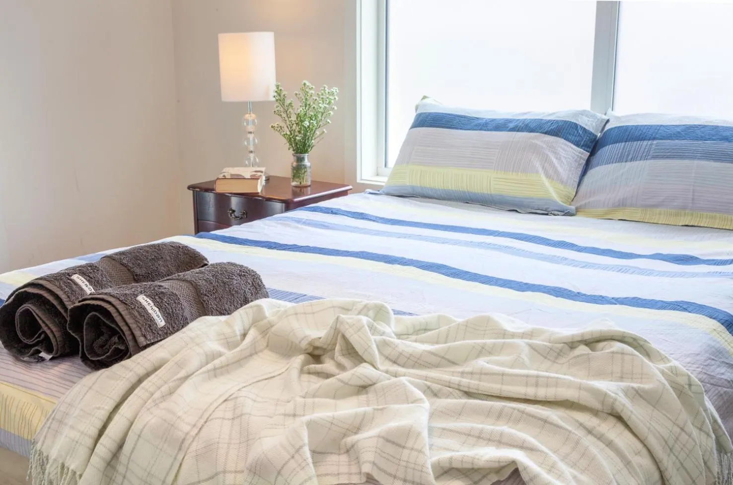 Bed in One of a Kind Apartments