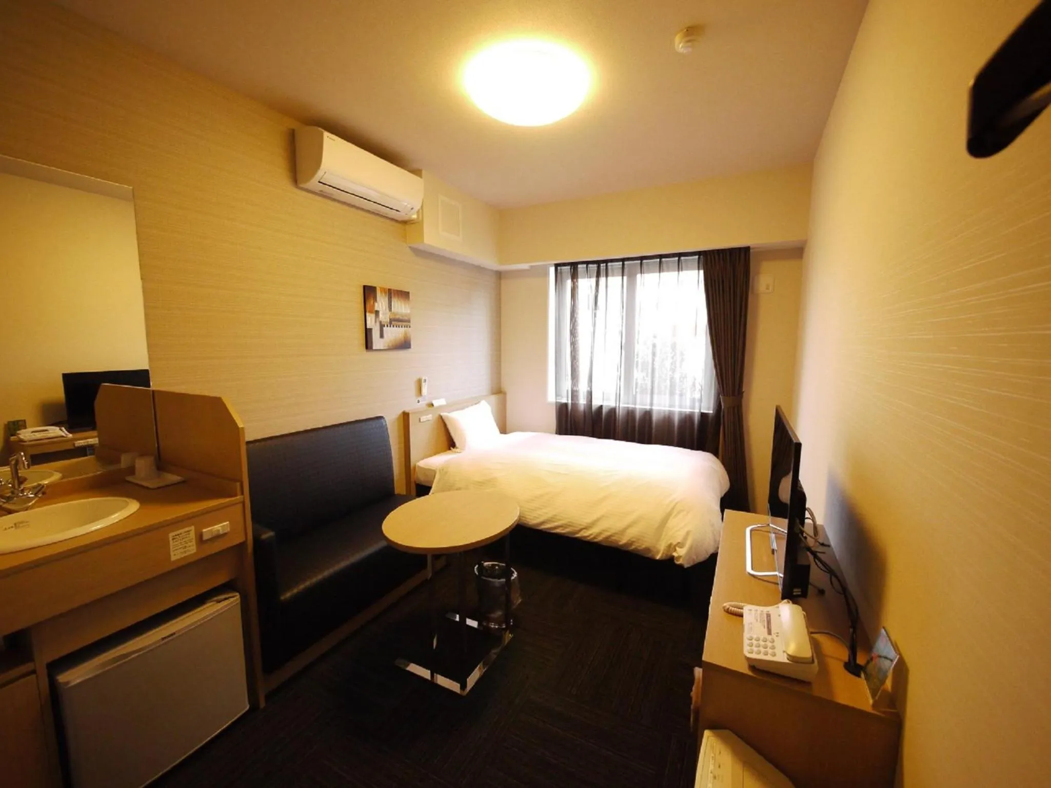 Bed in Hotel Route Inn Tagajo-Eki Higashi