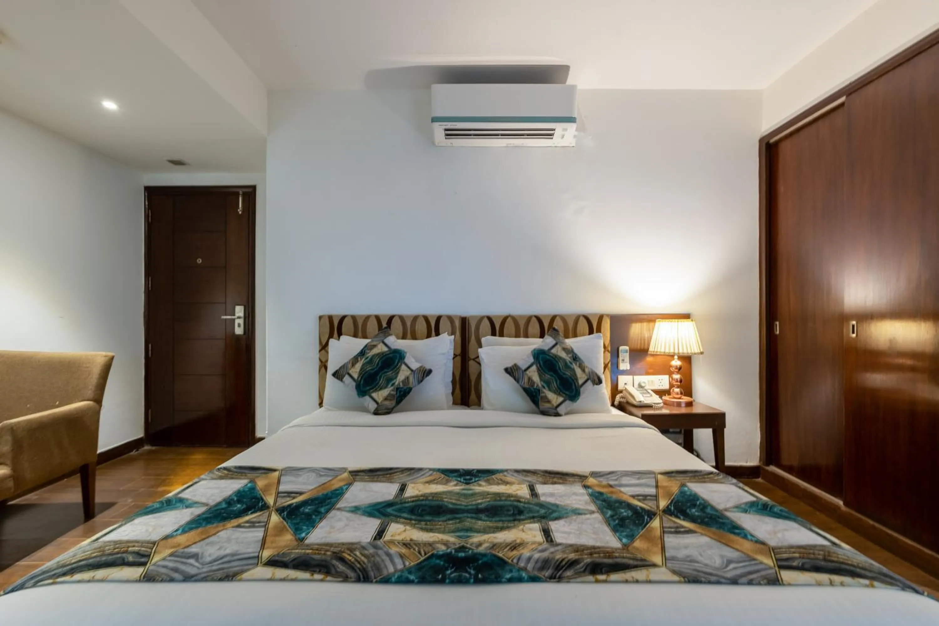 Bed in Hotel Arch Plaza at Yashobhoomi By Arch Group